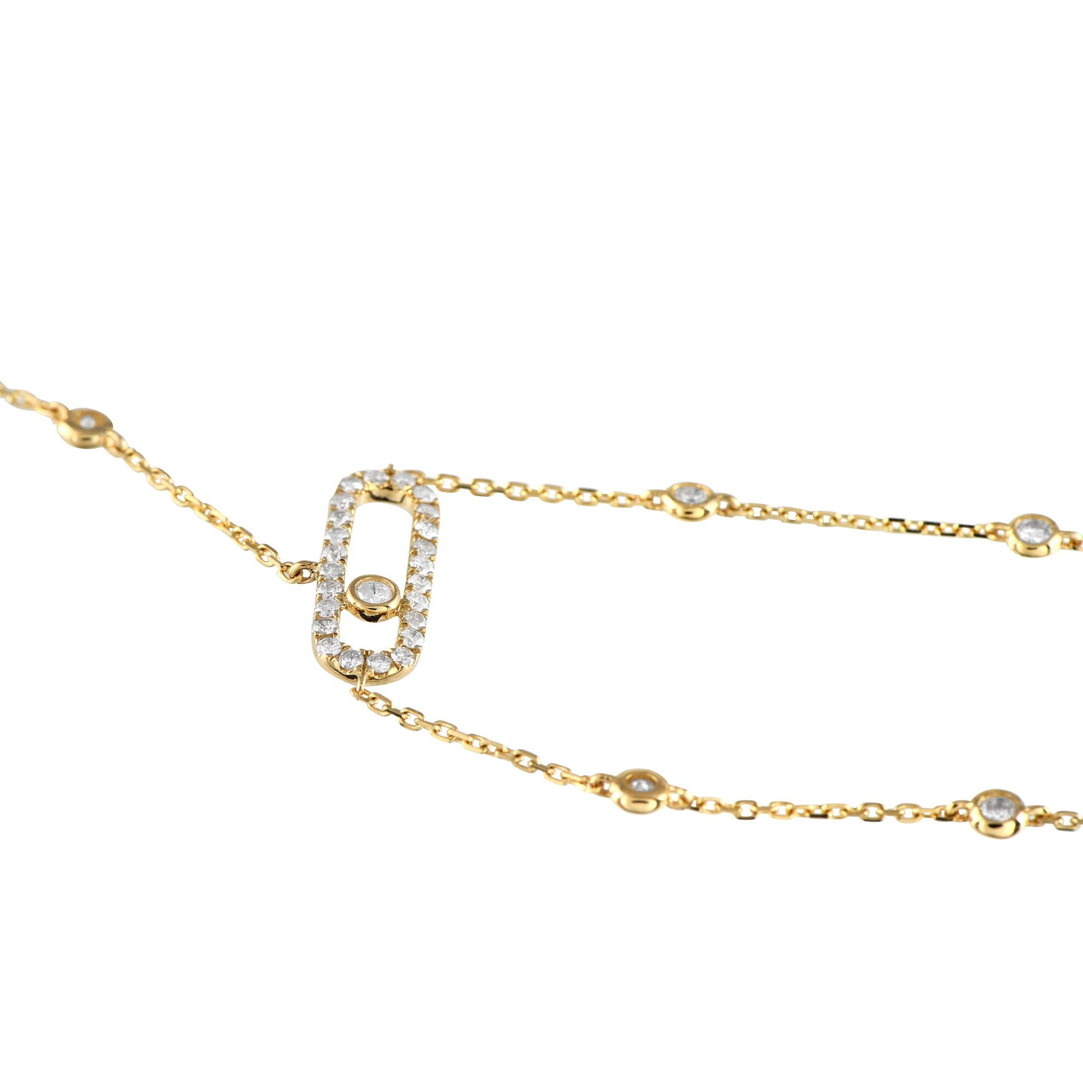 An piece designed with a seamless fusion of a ring and a bracelet. This piece features a delicate 14K yellow gold chain that drapes elegantly across the back of the hand. Petite round diamonds on bezel settings are positioned at evenly spaced