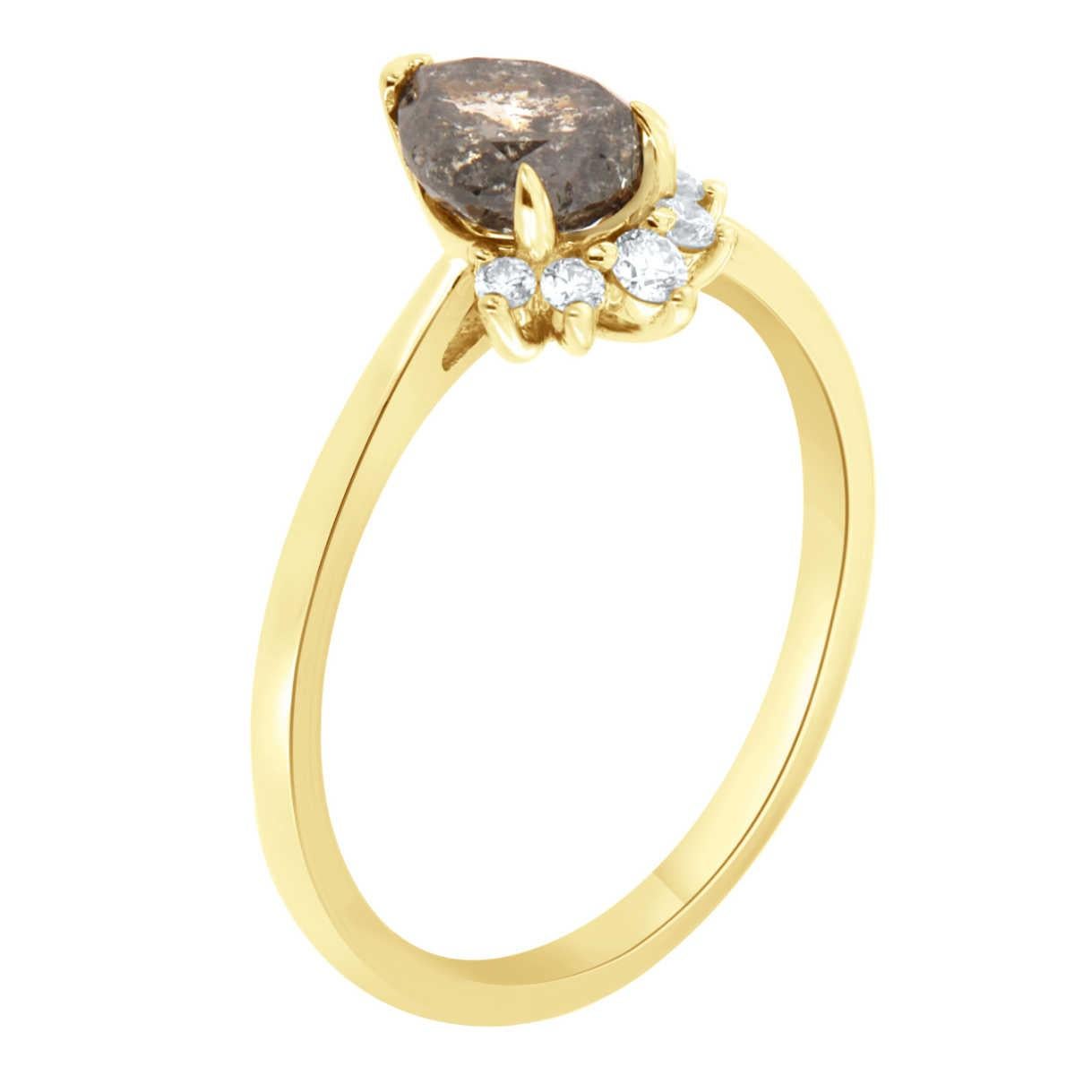 This 14k yellow gold delicate ring features a 0.93 Carat Pear shape Salt & Pepper Natural Diamond partially encircled by a half halo of five (5) brilliant round diamonds on top of a 1.5 MM wide band. 
The total round diamond weight on the ring is