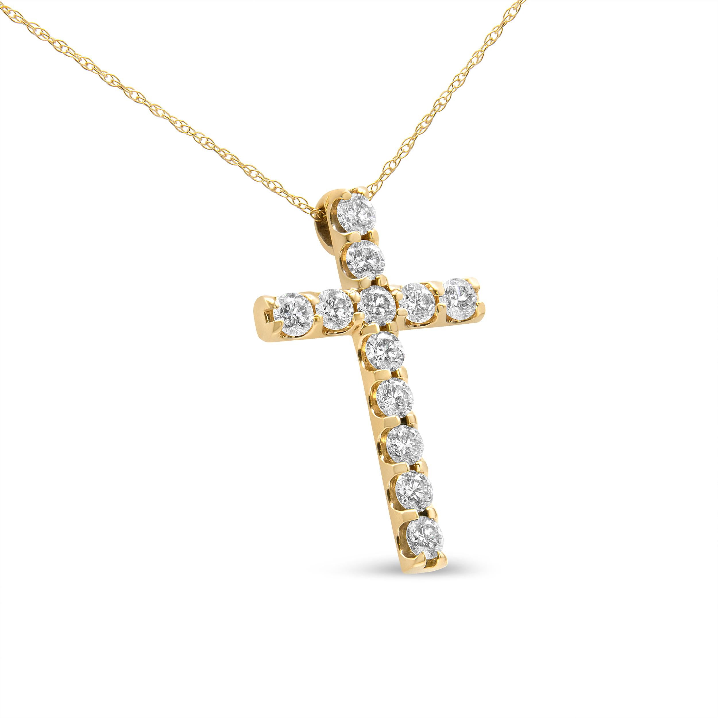 Showcase your inner devotion with this striking 1 1/10 c.t. diamond cross pendant necklace. The pendant is crafted in 14k yellow gold, a metal that will stay tarnish free for decades to come. The cross motif is embellished with sparkling, natural