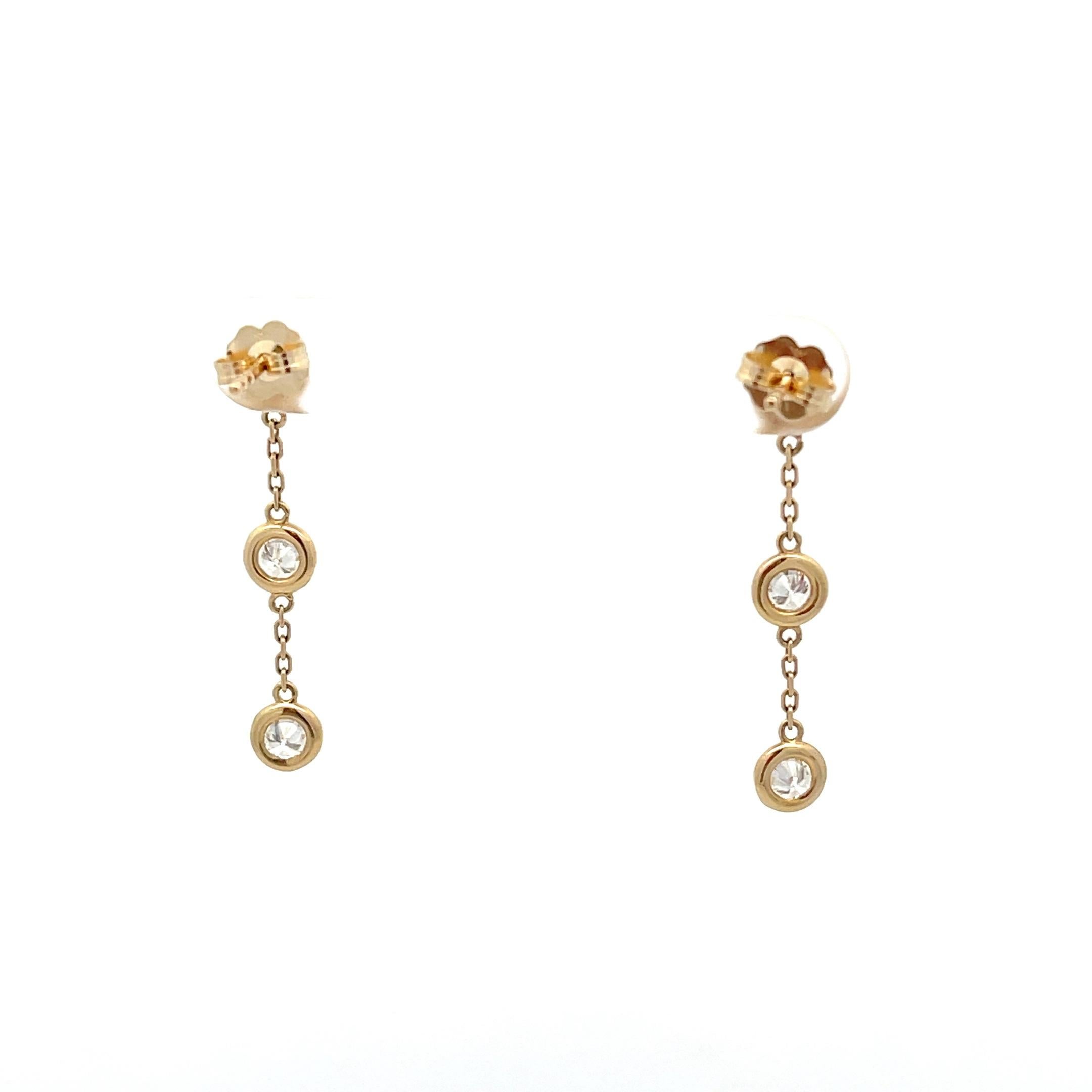 Introducing elegance redefined with our exquisite 14K Yellow Gold 1.10ctw Diamonds by the Yard Drop Earrings. Radiate timeless charm and sophistication with these captivating earrings that effortlessly blend classic design with modern flair. Crafted