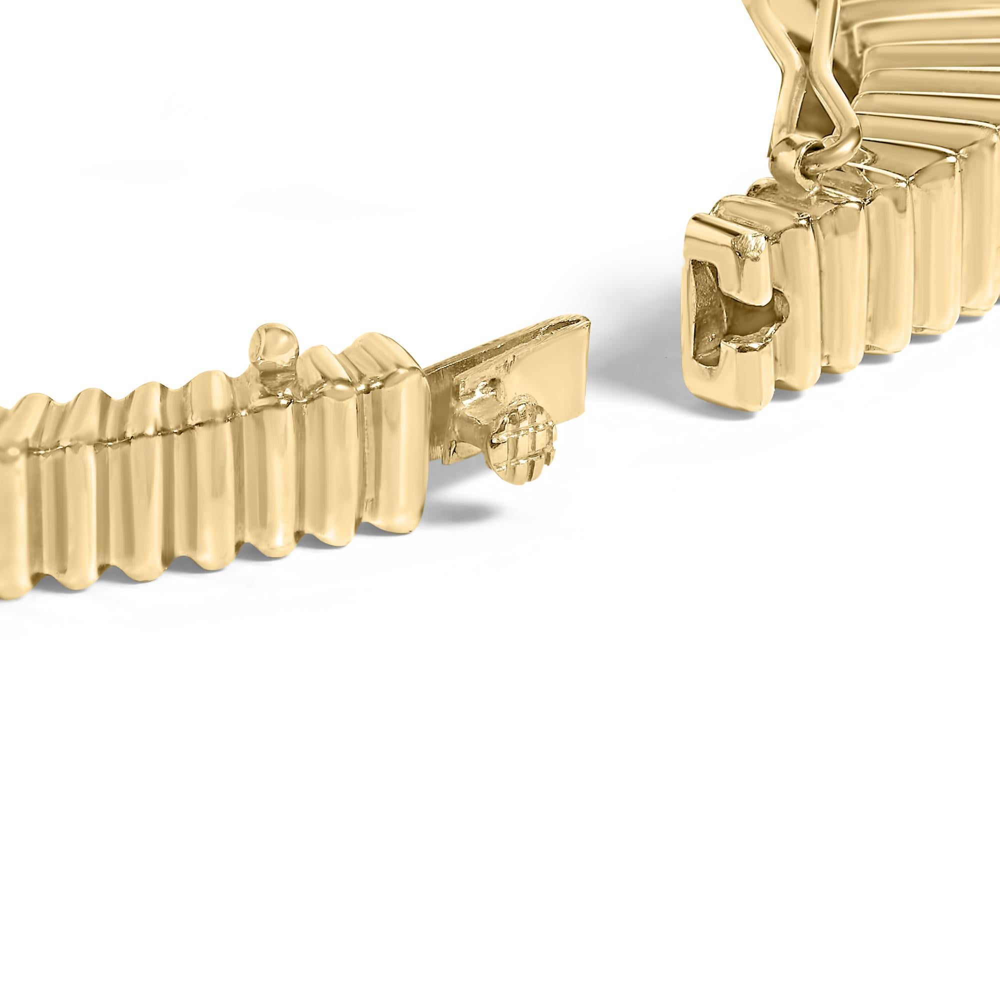Discover elegance that wraps your wrist with luxurious precision in this 14K yellow gold bangle. Designed to captivate and charm, the bracelet glimmers with a lavish row of natural diamonds, totaling 1 1/4 carats. Each stone, with a clarity of
