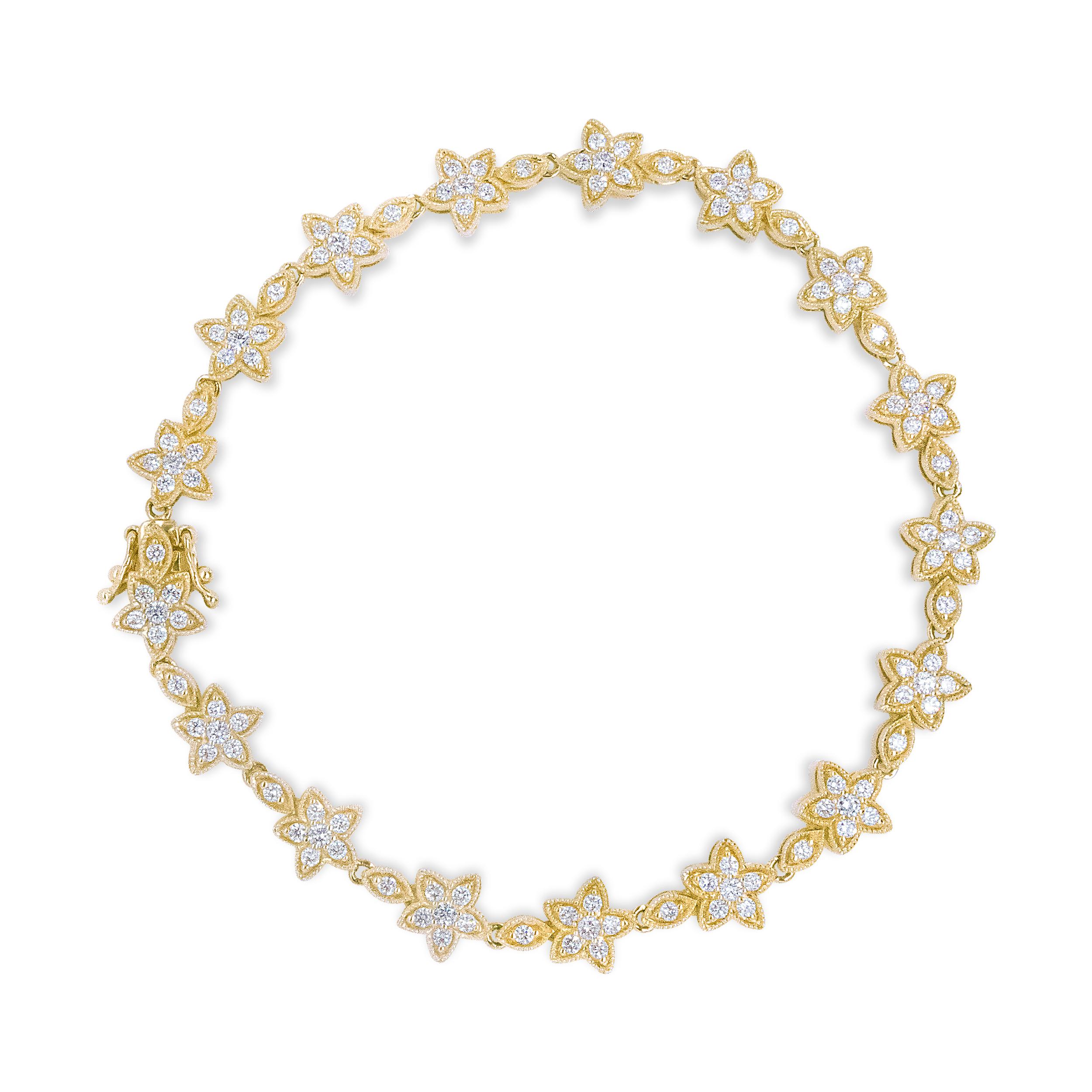 A Mother Nature inspired piece, this floral link bracelet pairs a star-shaped silhouette with the beauty of genuine 14k yellow gold and glimmering white diamonds. Slip this beauty on your wrist and experience the luxury of a total 1 1/5 cttw
