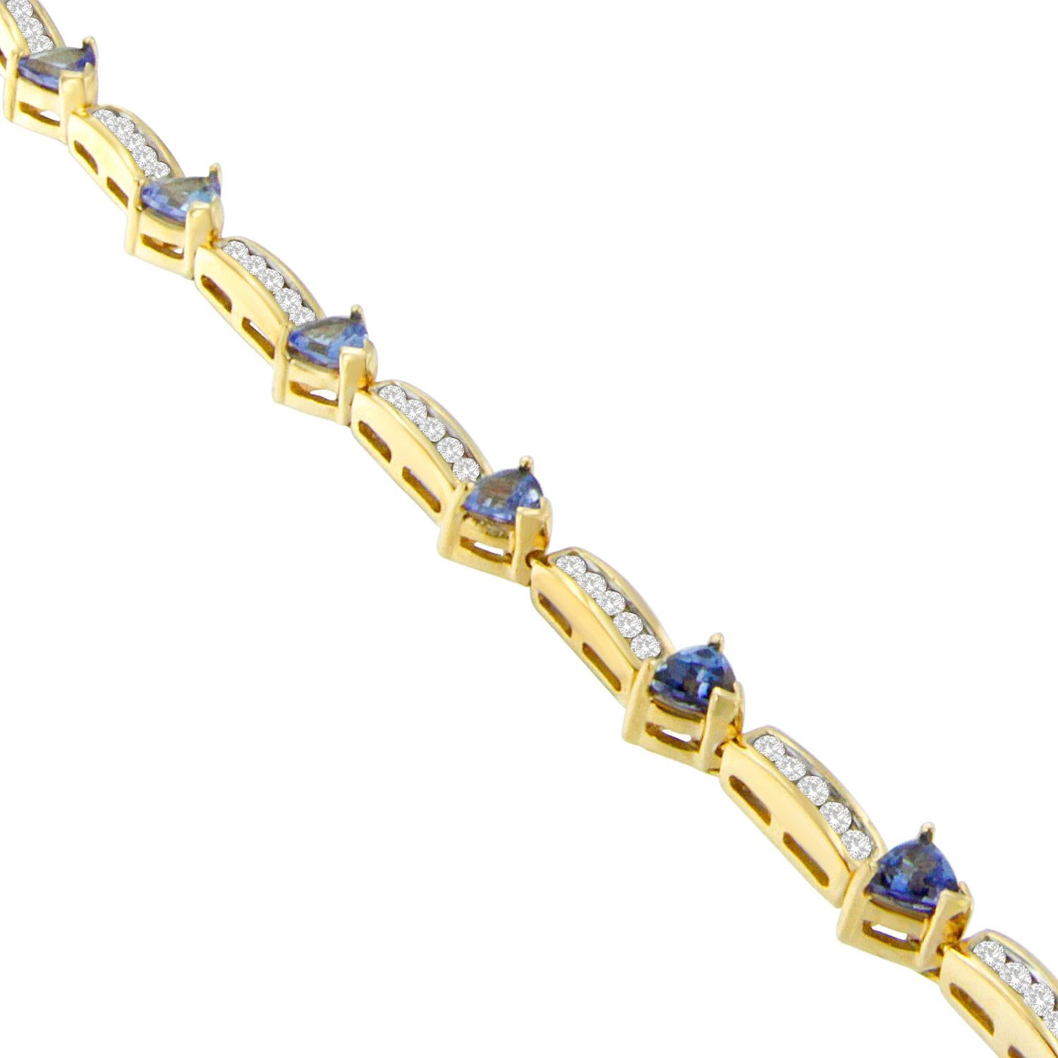 Give the gift of timeless elegance with this 14k yellow gold, diamond, and gemstone bracelet. Links alternate between lush blue tanzanite and round cut diamonds for a look that is classic without being fussy. Each piece is polished to perfection and