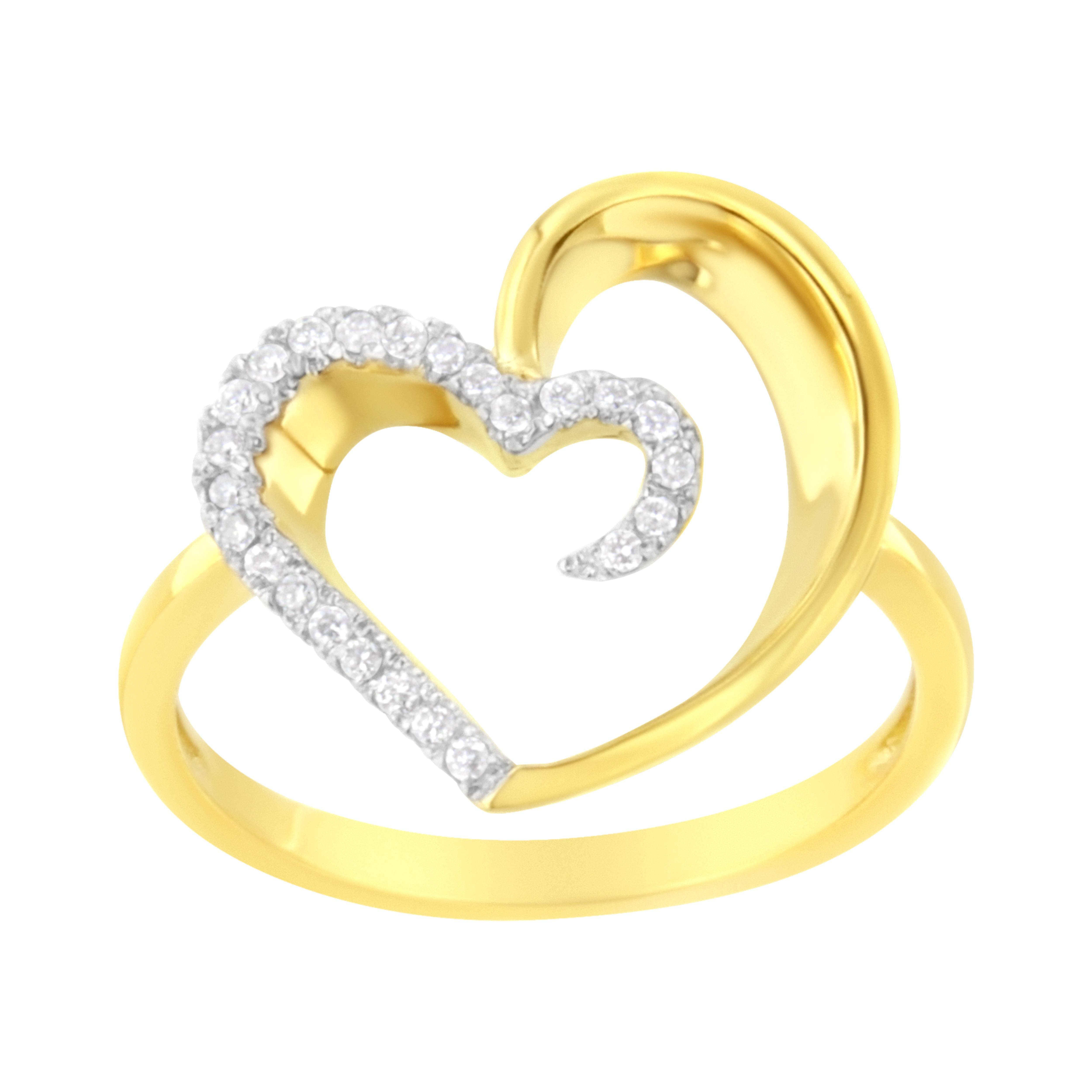 Surprise her with this romantic Diamond Heart Ring, a perfect symbol of love. This modish heart ring showcases 24 brilliant round cut diamonds fashioned in luminous 14 karat yellow gold band in beautiful pave setting. Total diamond weight is 1/10