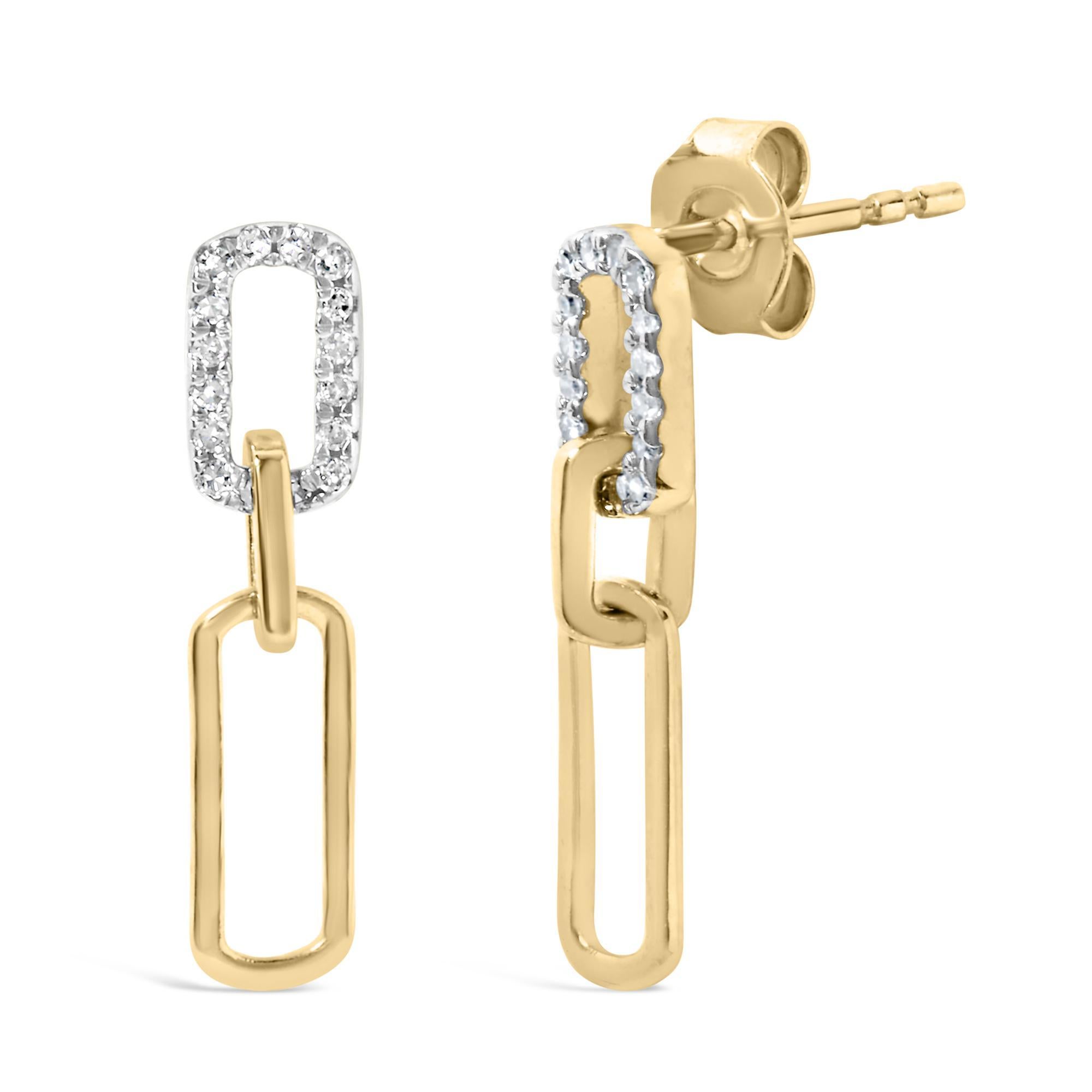 Découvrez la quintessence de la sophistication et du charme moderne avec ces boucles d'oreilles en or jaune 14K magnifiquement travaillées. Chaque pièce est délicatement suspendue à un centimètre, ornée d'un trombone contemporain qui incarne