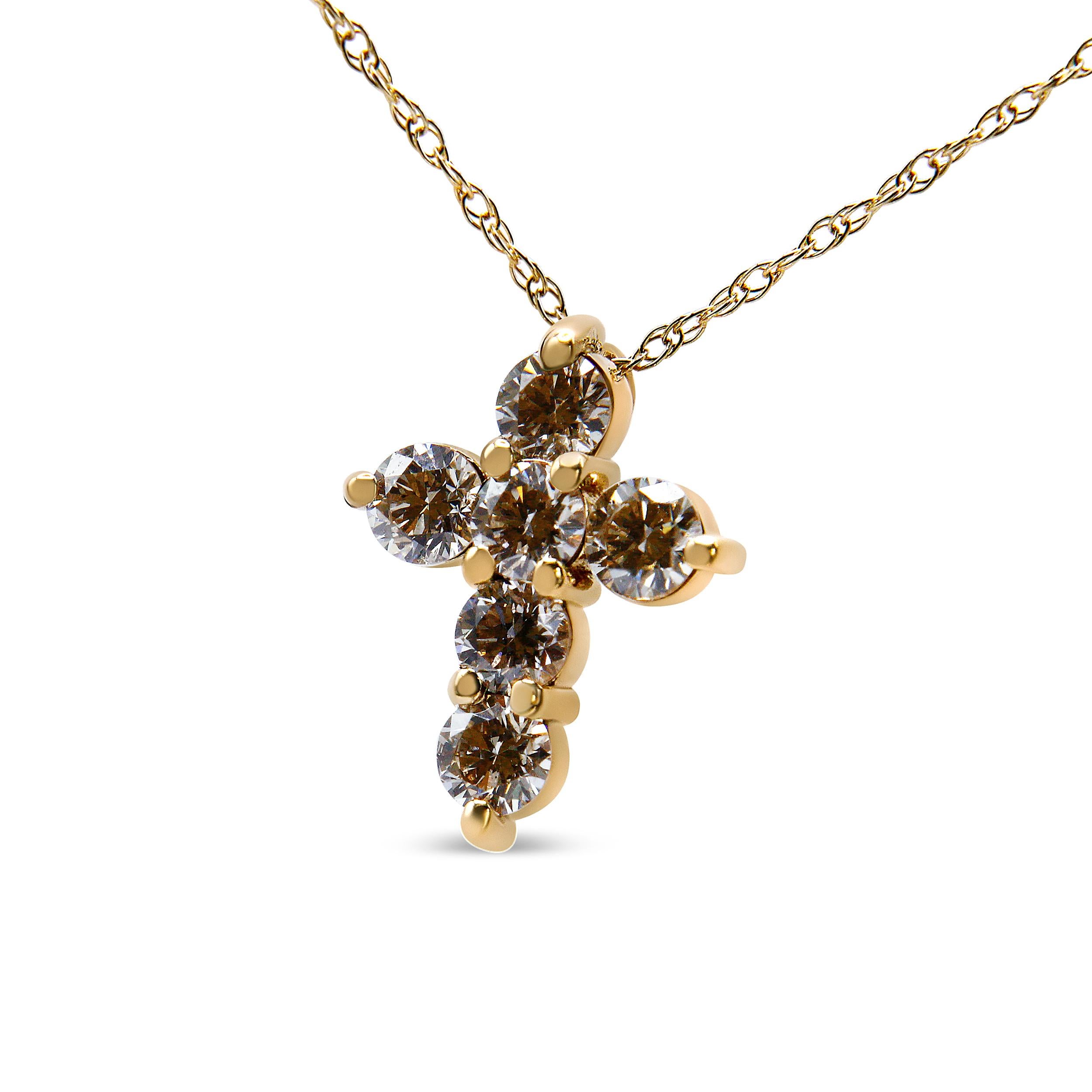 Showcase your inner devotion with this striking 1/2 c.t. diamond cross necklace. The pendant is crafted in 14k yellow gold, a metal that will stay tarnish free for decades to come. The cross motif is embellished with 6 sparkling, natural round-cut