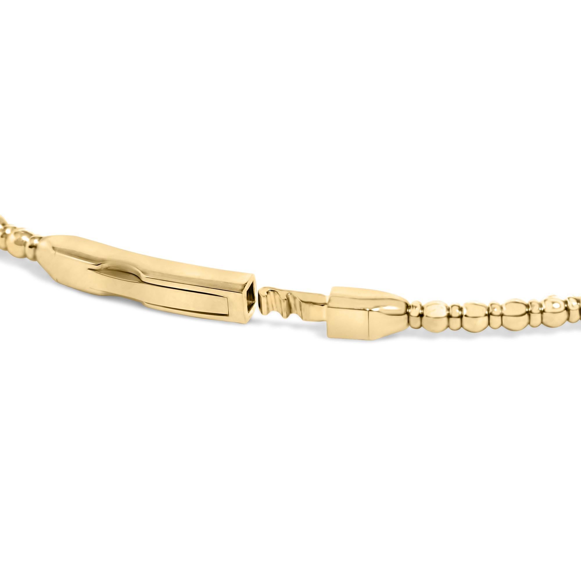 Imbued with a sense of refined elegance, this bangle crafted from radiant 14K yellow gold captivates the beholder with its unique quatrefoil clover motifs that intersperse its circumference. Each clover is meticulously brought to life with four