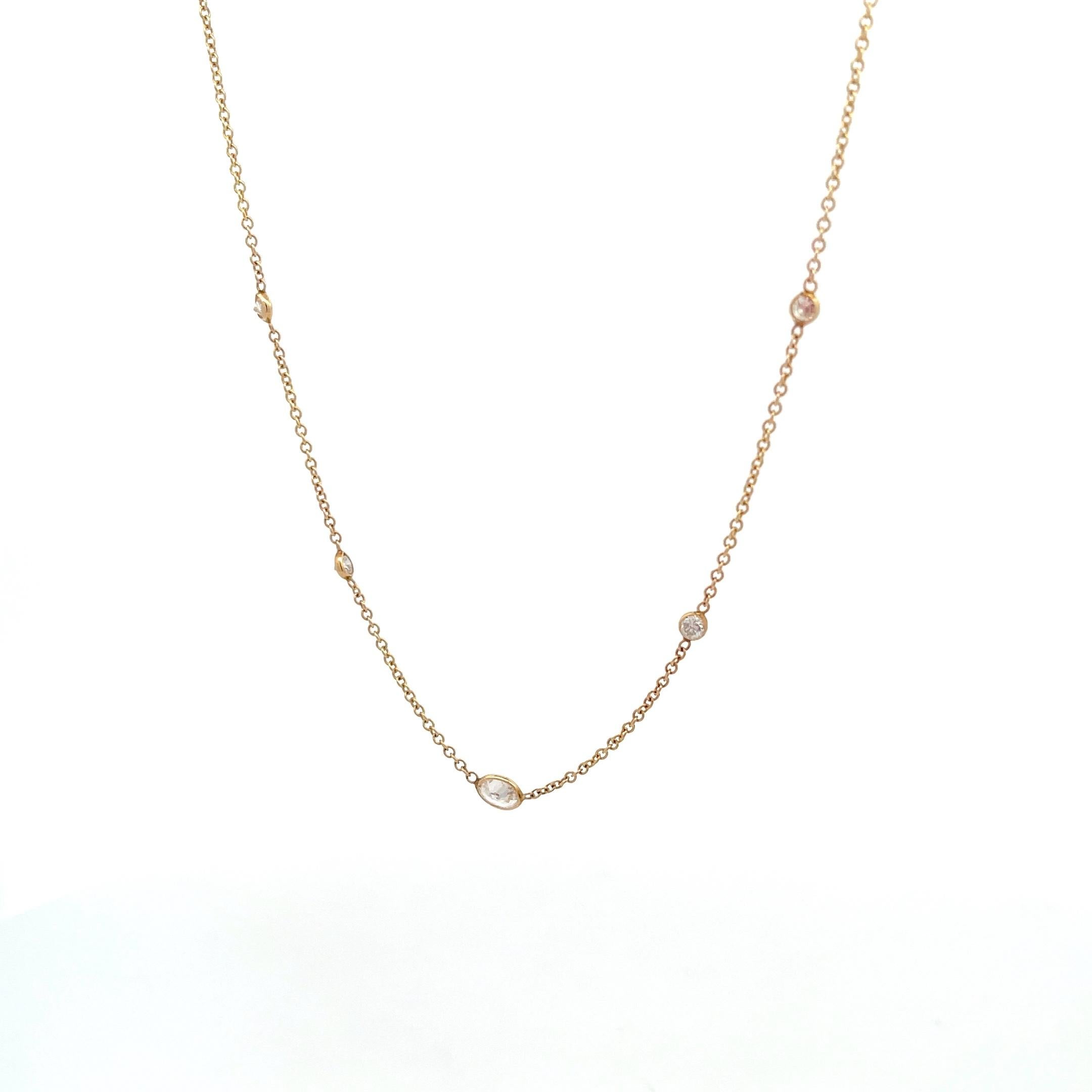 Introducing our exquisite 14K Yellow Gold 1/2ctw 5 station Diamonds-by-the-Yard Necklace with 0.25ctw Oval Center - a dazzling masterpiece to elevate your style. Crafted in 14K yellow gold, this necklace exudes elegance and charm. Adorned with