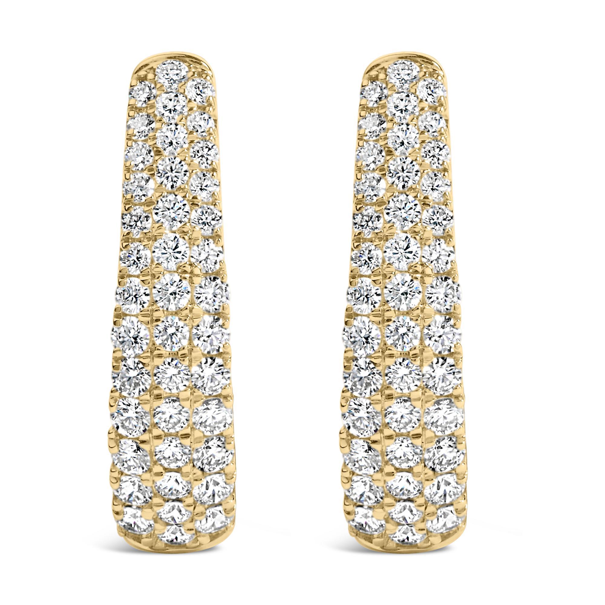 Discover opulence that dangles delicately with these 14K yellow gold hoop earrings, where elegance meets a spark of brilliance. These exquisite jewels, gleaming with a polished finish for that extra touch of luster, introduce a mesmerizing pave of