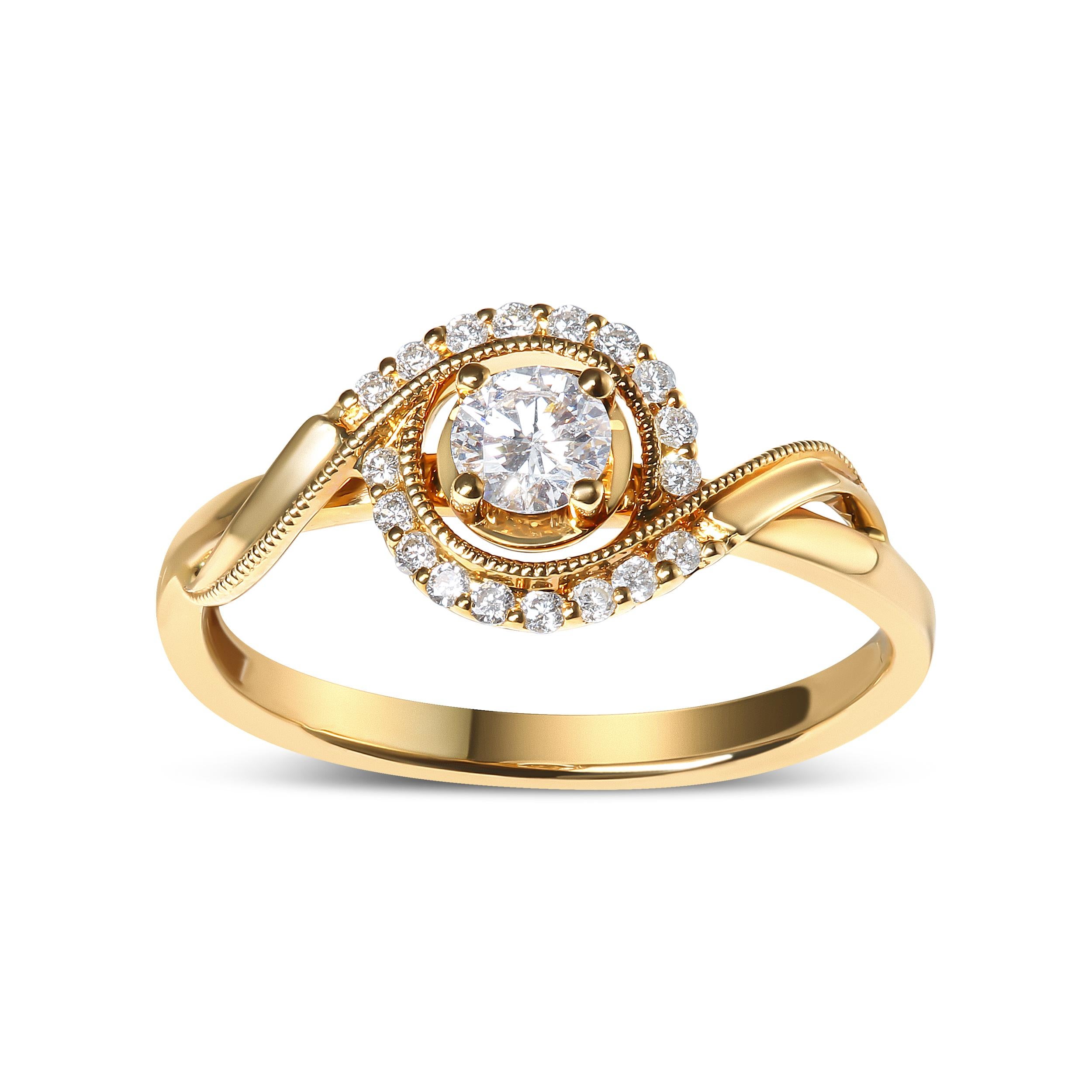 Incarnant l'essence de la romance et de l'amour éternel, cette exquise bague de fiançailles en or jaune 14 carats brille avec un époustouflant diamant rond de 1/4 cttw, bercé en son cœur dans une monture sécurisée à 4 branches, rayonnant d'une