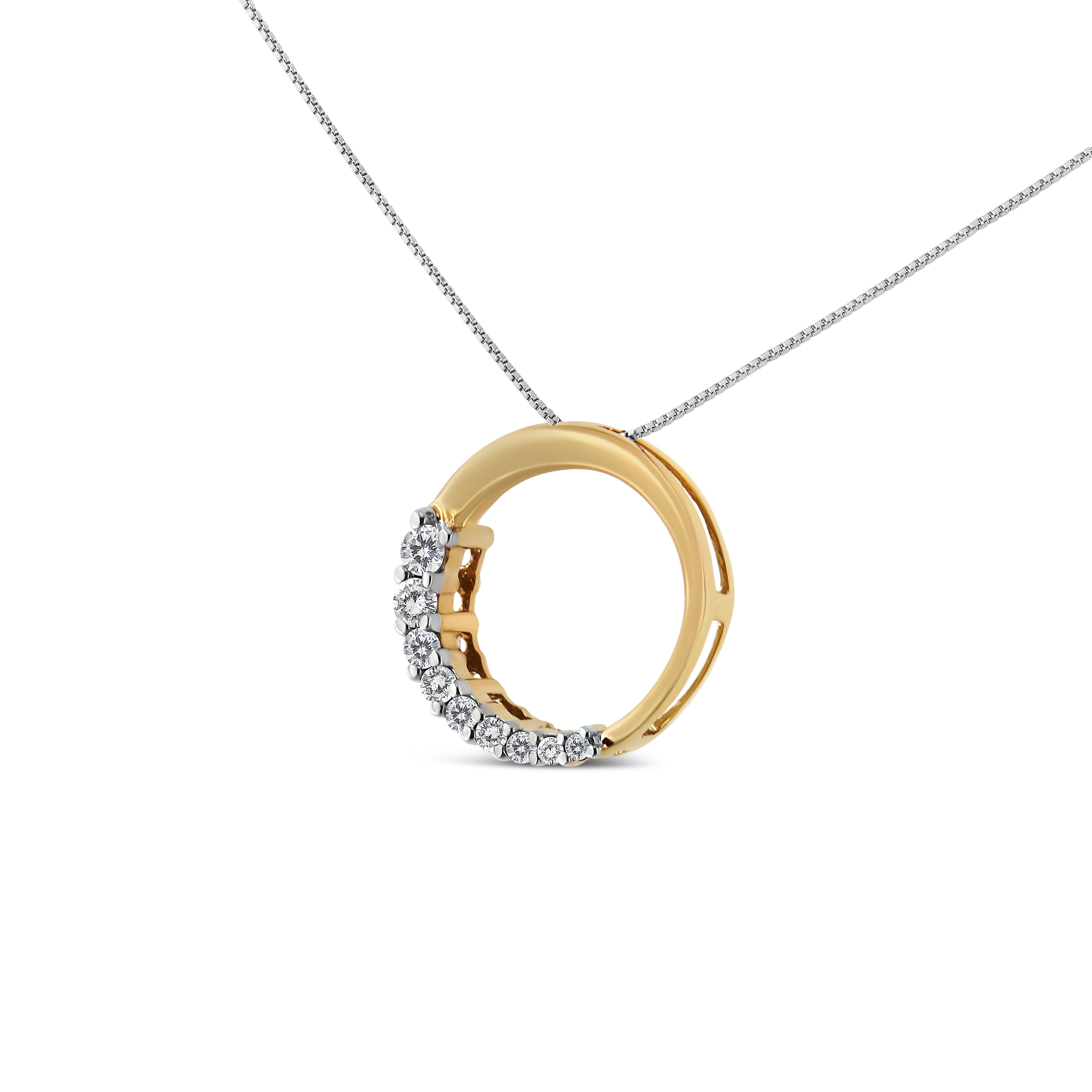 From a box chain an open circle pendant delicately dangles. Crafted in 14k yellow gold, this exquisite pendant showcases 1/4ct TDW of diamonds. Glittering round cut diamonds graduating in size sparkle on half of the open circle design. The necklace
