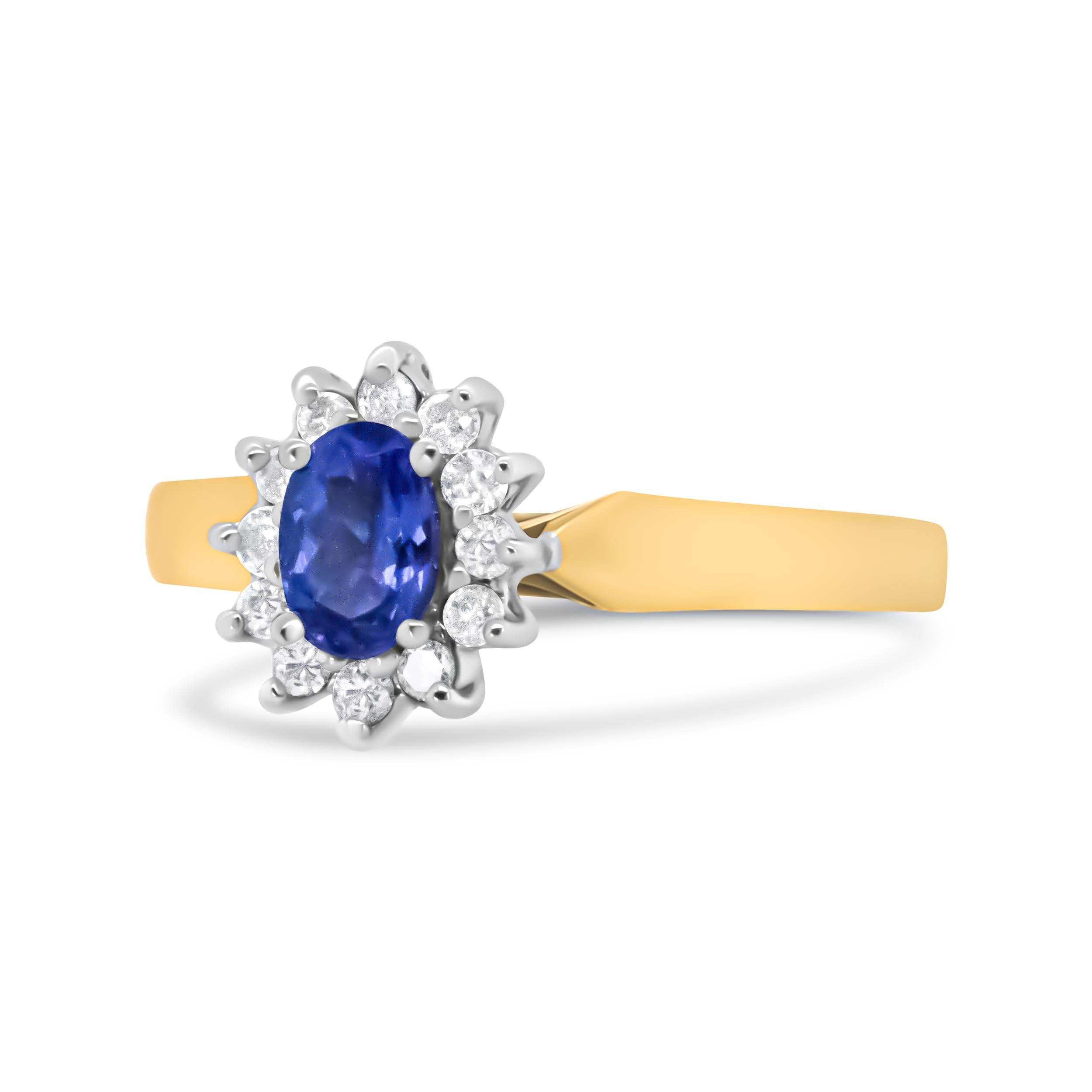 She will adore the color and shimmering splendor of this diamond and gemstone halo ring. Set at the center of this ring is a brilliant cut, oval blue tanzanite gemstone. A glimmering halo of round white diamonds sparkle wondrously from their prong