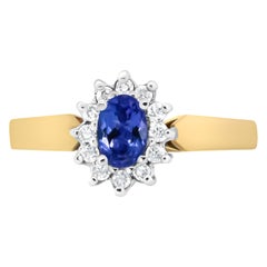 14K Yellow Gold 1/5 Carat Round Diamond and 6x4mm Oval Blue Tanzanite Halo Ring