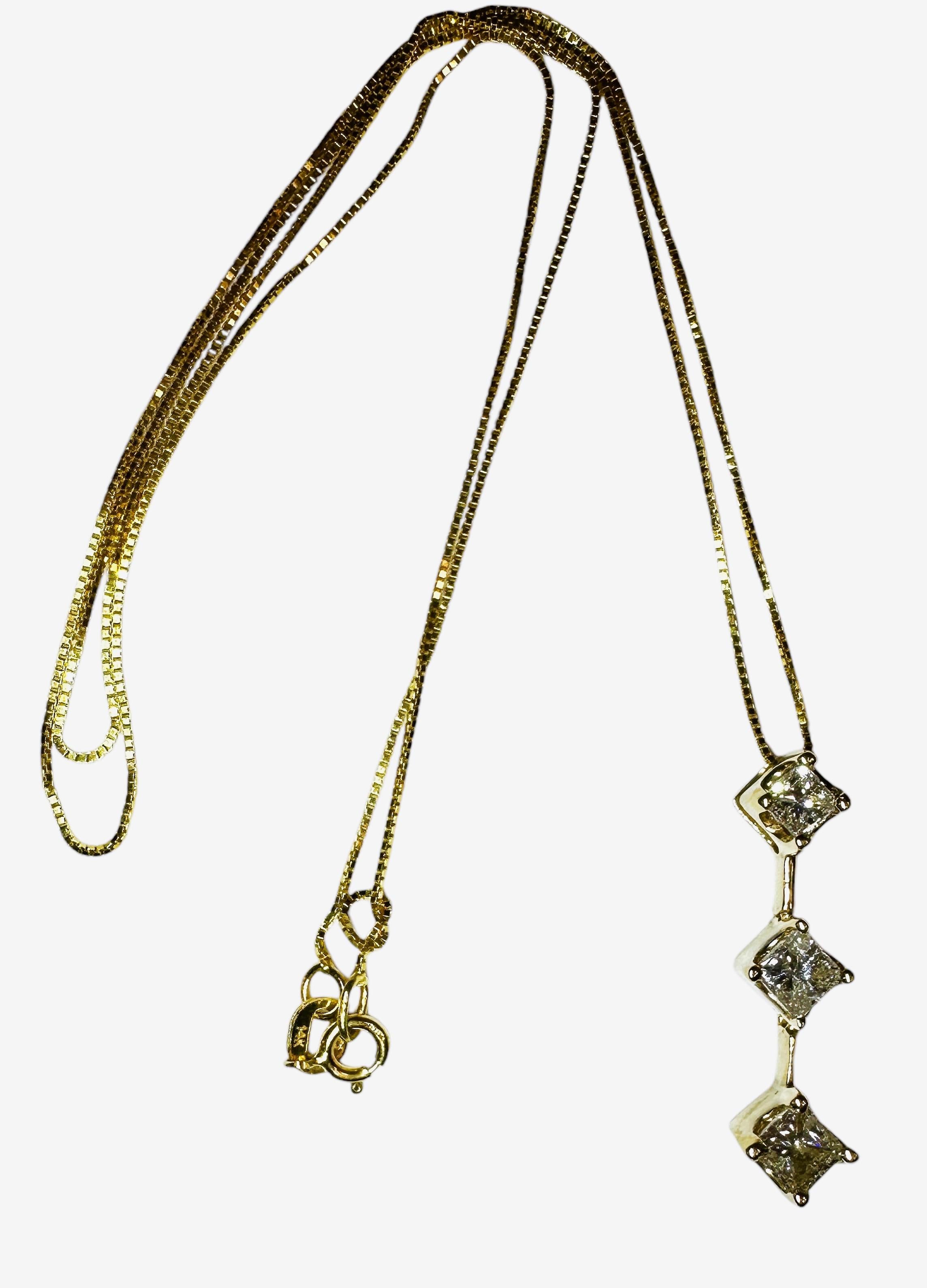 This is a beautiful classic necklace with 3  princess cut diamonds  that graduate in size as they go down.  The top diamond is 3.3 x 3.2 mm, the middle diamond is 3.8 x 3.7 and the bottom diamond is 4.0 x 3.9 mm and they total 1 carat.  I cannot