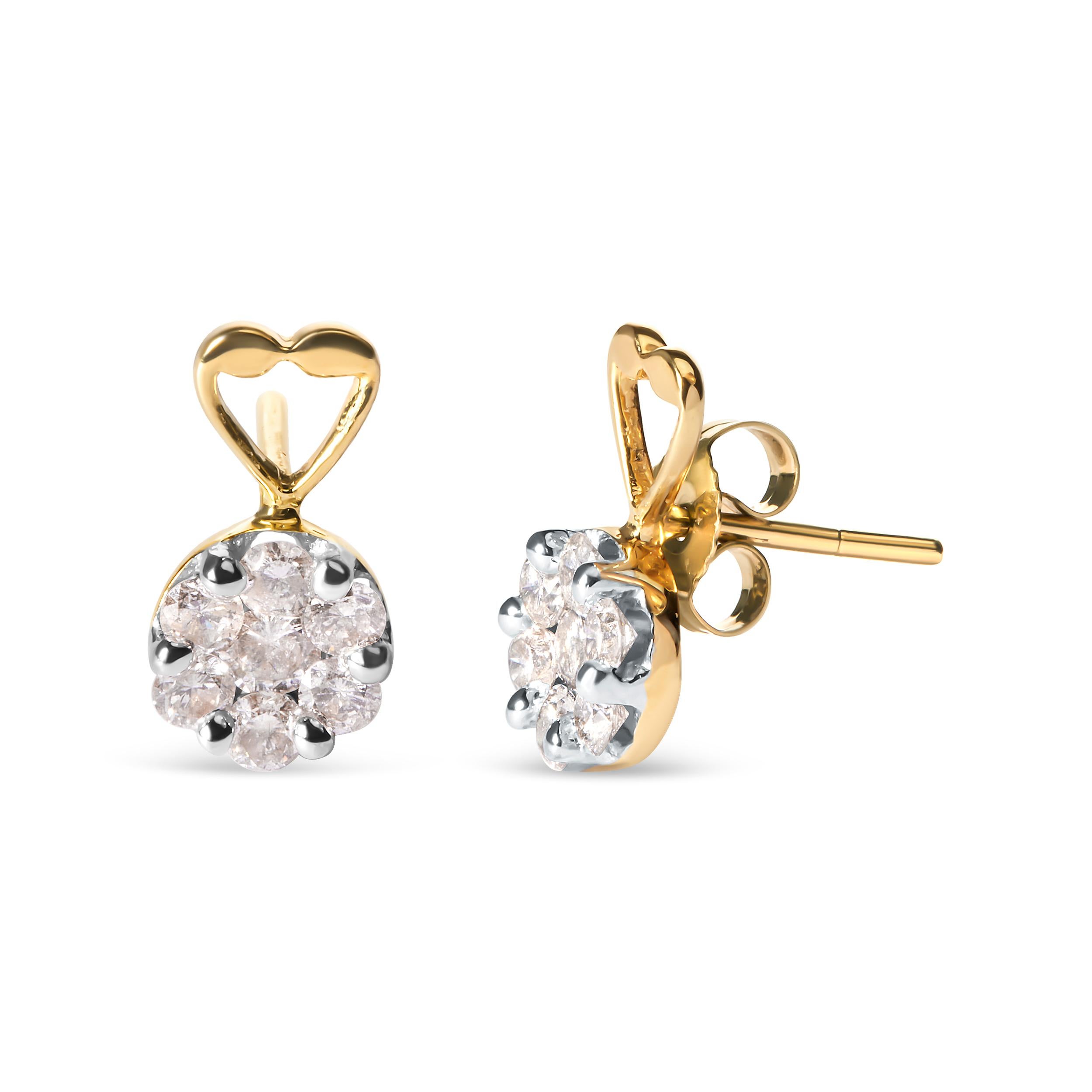 Every piece of jewelry has a little story behind it and define yours with these exquisite earrings. Created with 14 karats yellow gold, the earrings feature heart accent on the top. Both the earrings are ornate with shimmering round cut diamonds