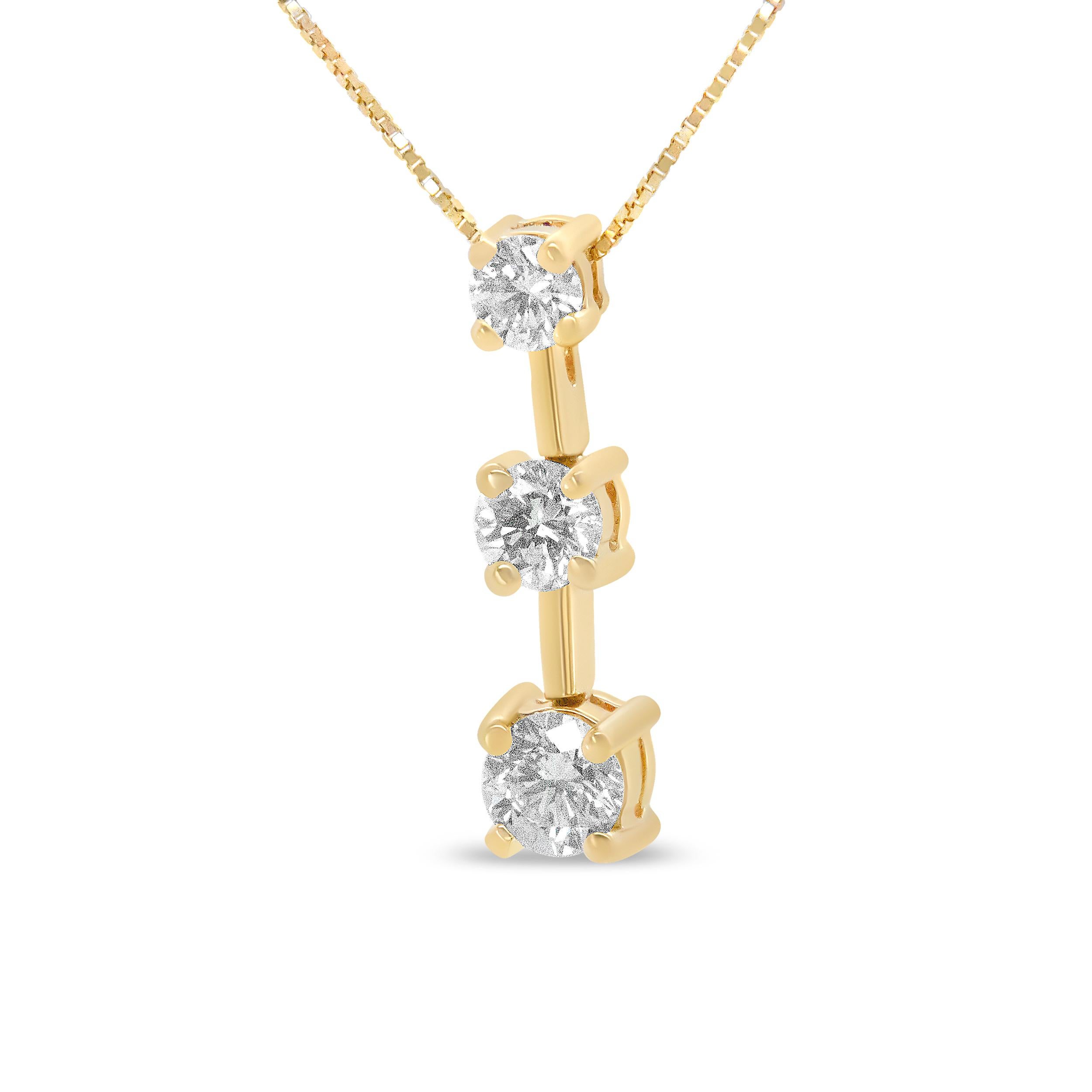 This three stone drop journey pendant necklace is a symbolic piece representing your past, present, and future. Three round diamonds in prong settings cascade downward in gradual sizes, with the diamonds totaling 1.00 cttw and an approximate H-I