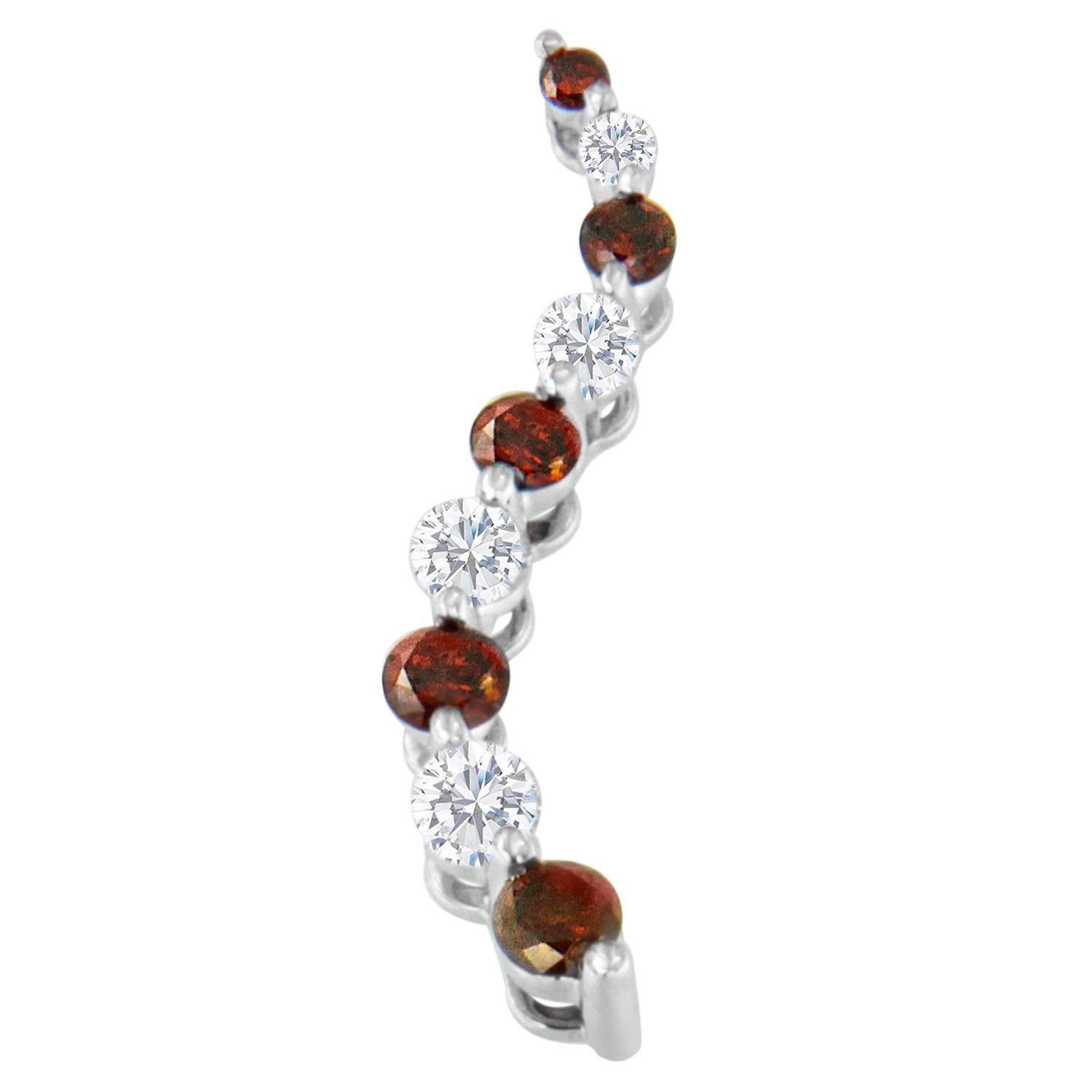A cascading S curve of 14k white gold showcases round-cut red and white diamonds in this coveted pendant. Each stone is carefully prong set to catch the light for maximum sparkle. Ships with size 18 chain secured with a spring ring clasp.

'Video