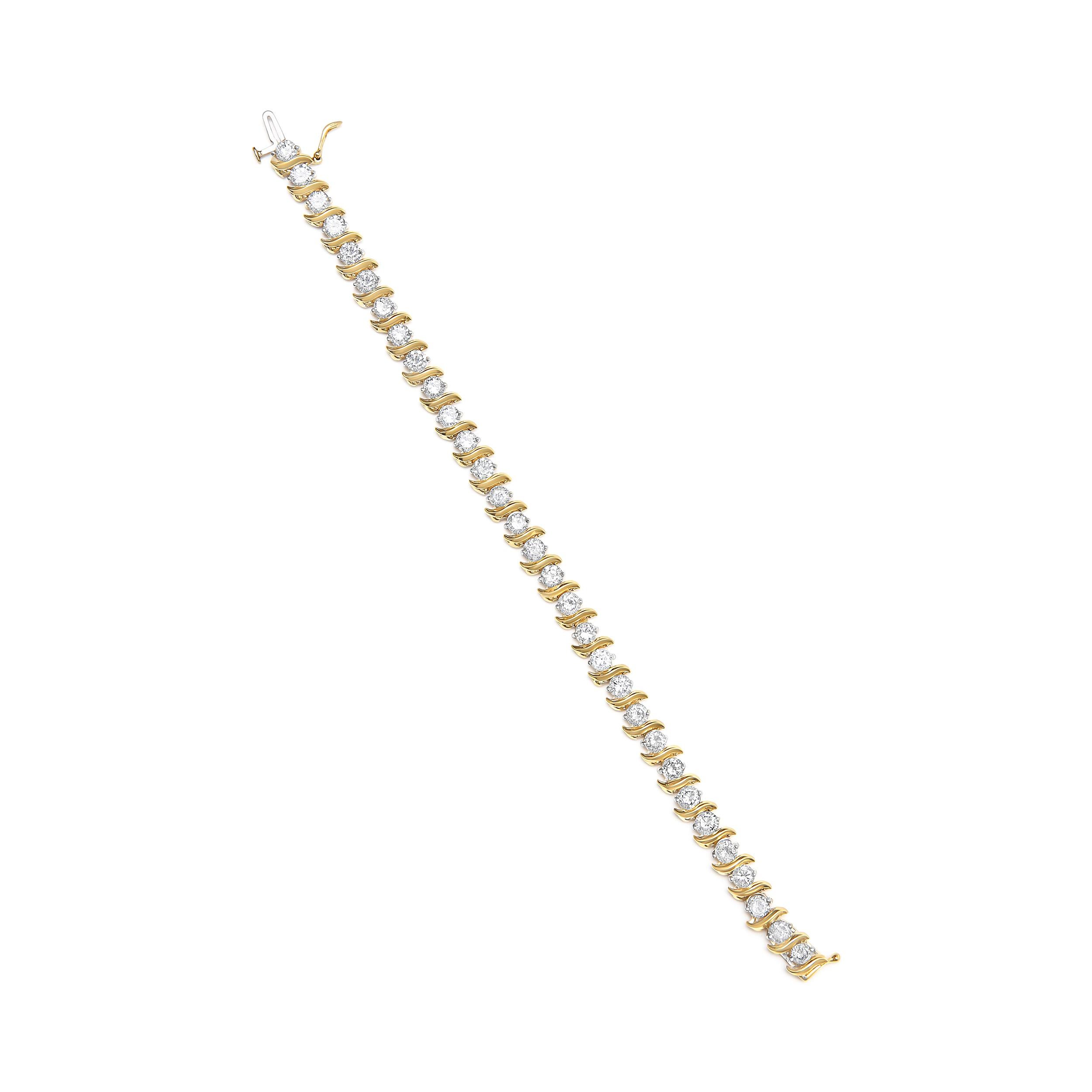 Make a bold and stunning statement with this magnificent 14K yellow gold S-link bracelet. The piece showcases 31 natural round cut diamonds, weighing in at a magnificent 10.0 carats. The diamonds boast a warm J-K color and a clarity of SI2-I1,