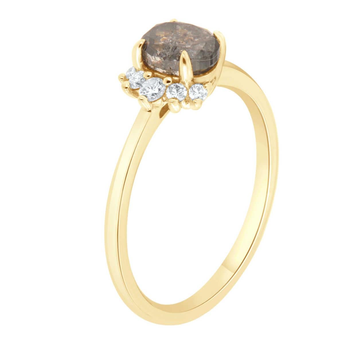 This 14k yellow gold delicate ring features a 1.04 Carat Oval shape Salt & Pepper Natural Diamond partially encircled by a half halo of five (5) brilliant round diamonds on top of a 1.5 MM wide band. 
The total round diamond weight on the ring is