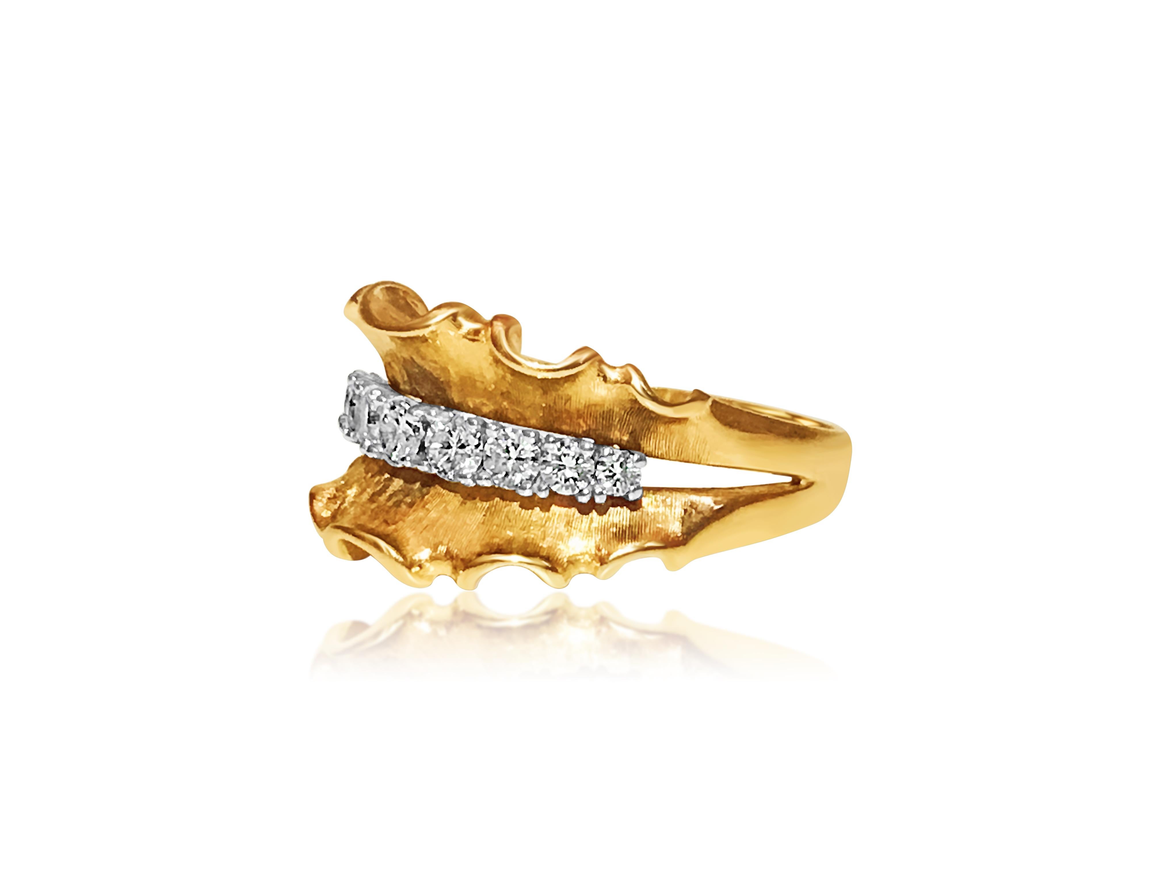 This is a lovely 14-karat yellow gold piece with 9 diamonds totaling 1.10 carats. The diamonds are high quality, with VS clarity and F color, and they sparkle beautifully. The setting is done with prongs, and the entire piece weighs 5.66