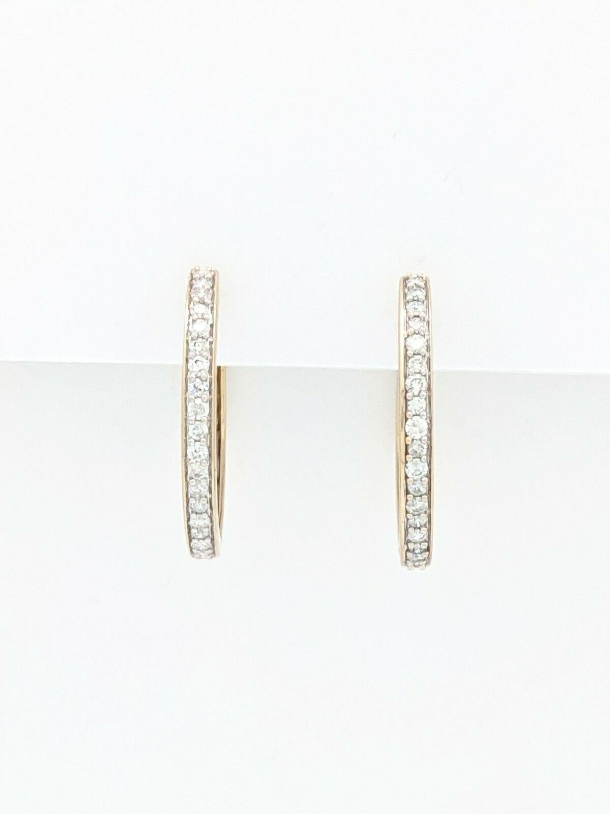 You are viewing a beautiful pair of Diamond Hoop earrings crafted from 14k yellow gold. These beauties weigh 7.6 grams and offer approximately 1.14cts of round brilliant diamonds.

Each hoop measures 19mm in diameter and 3mm in width and feature