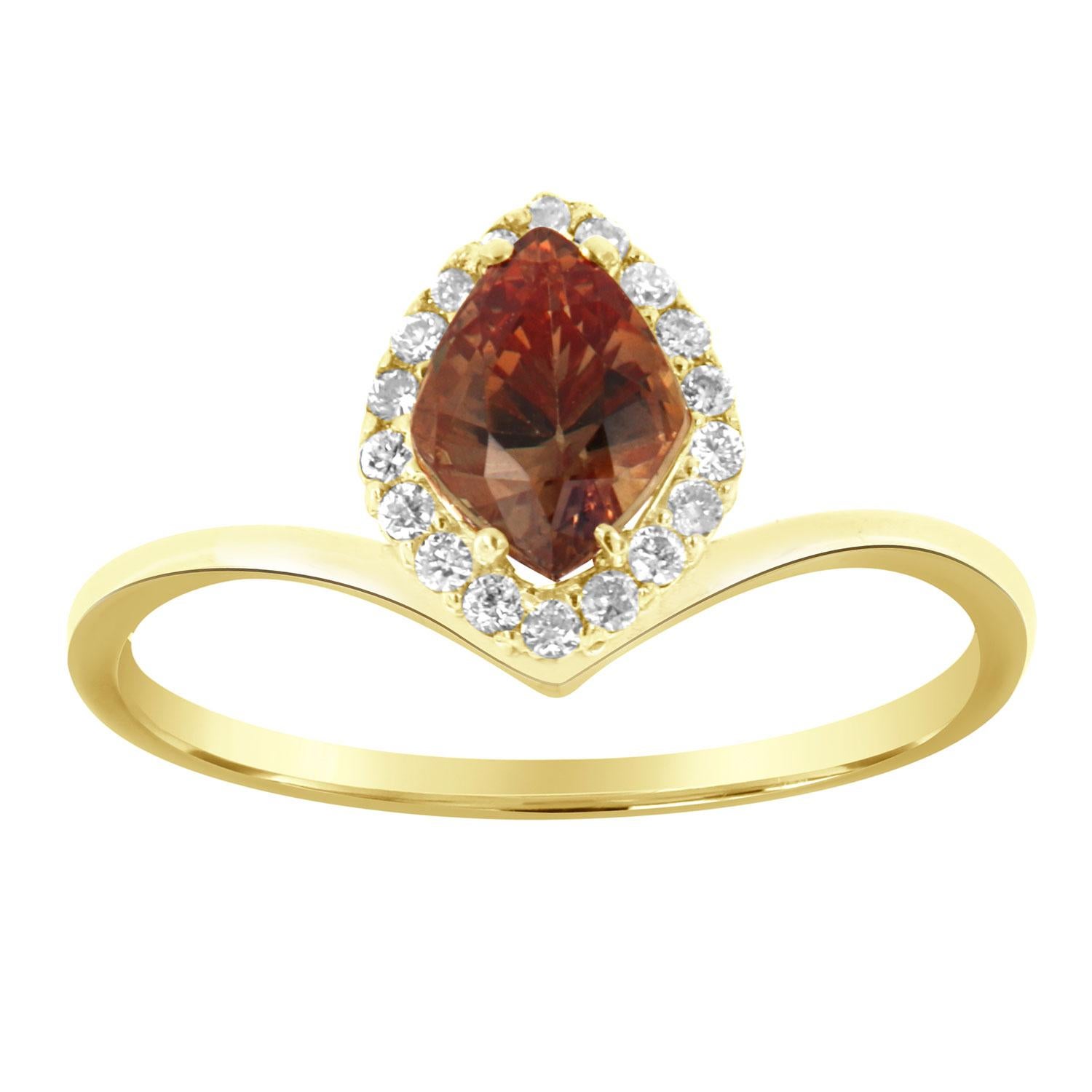 This 14k yellow gold ring features a 1.16 Carat Kite-shaped Natural Sapphire in vibrant Champagne color with an excellent luster, encircled by a halo of brilliant round diamonds on a 1.2 mm wide band. A perfectly matched V-shaped diamond band