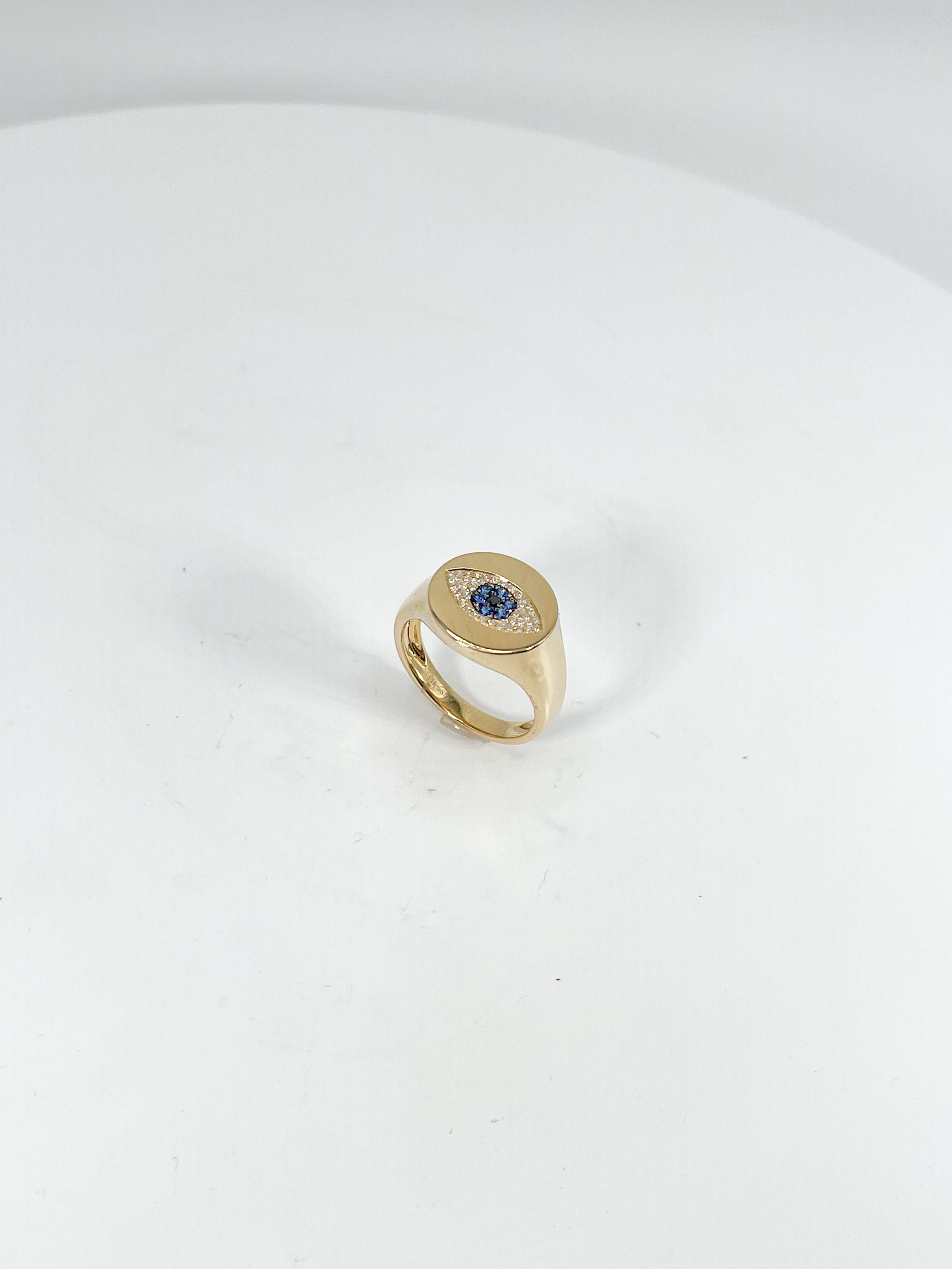 14k yellow gold .12 CTW diamond and .08 CTW sapphire evil eye ring. The stones are all round cut, the width of the ring is 13.5 mm, measures to be a size 7, and has a total weight of 4.6 grams.