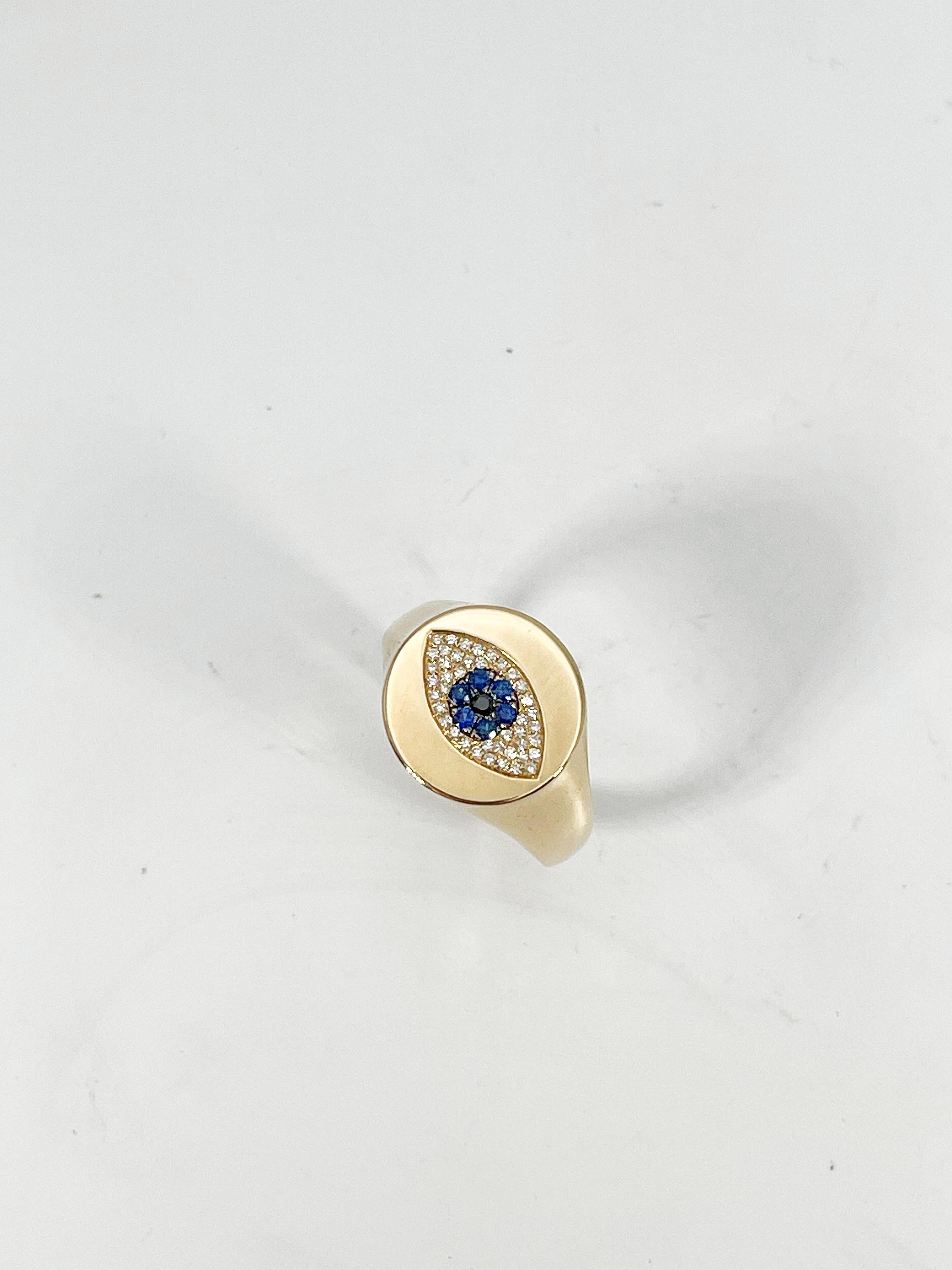 Round Cut 14K Yellow Gold .12 CTW Diamond and .08 CTW Sapphire Evil Eye Ring  For Sale