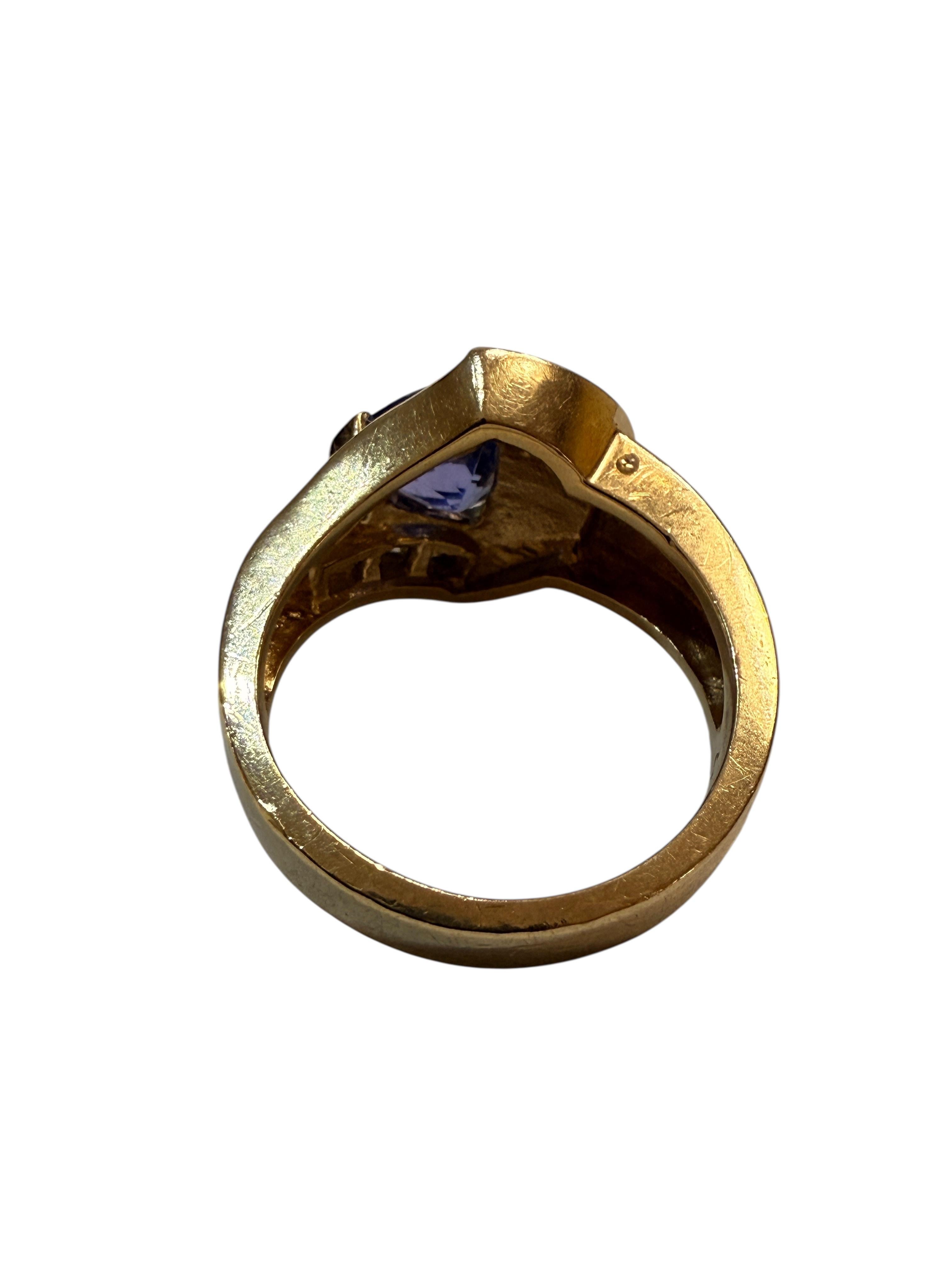 This is a very nice ring with lots of variety.  It has a trillion cut tanzanite stone measuring 9 x 7 mm.   It also has 8 diamonds measuring 1.5 mm running down one side of the band.  And on the other side of the ring is a variety of cut stones that