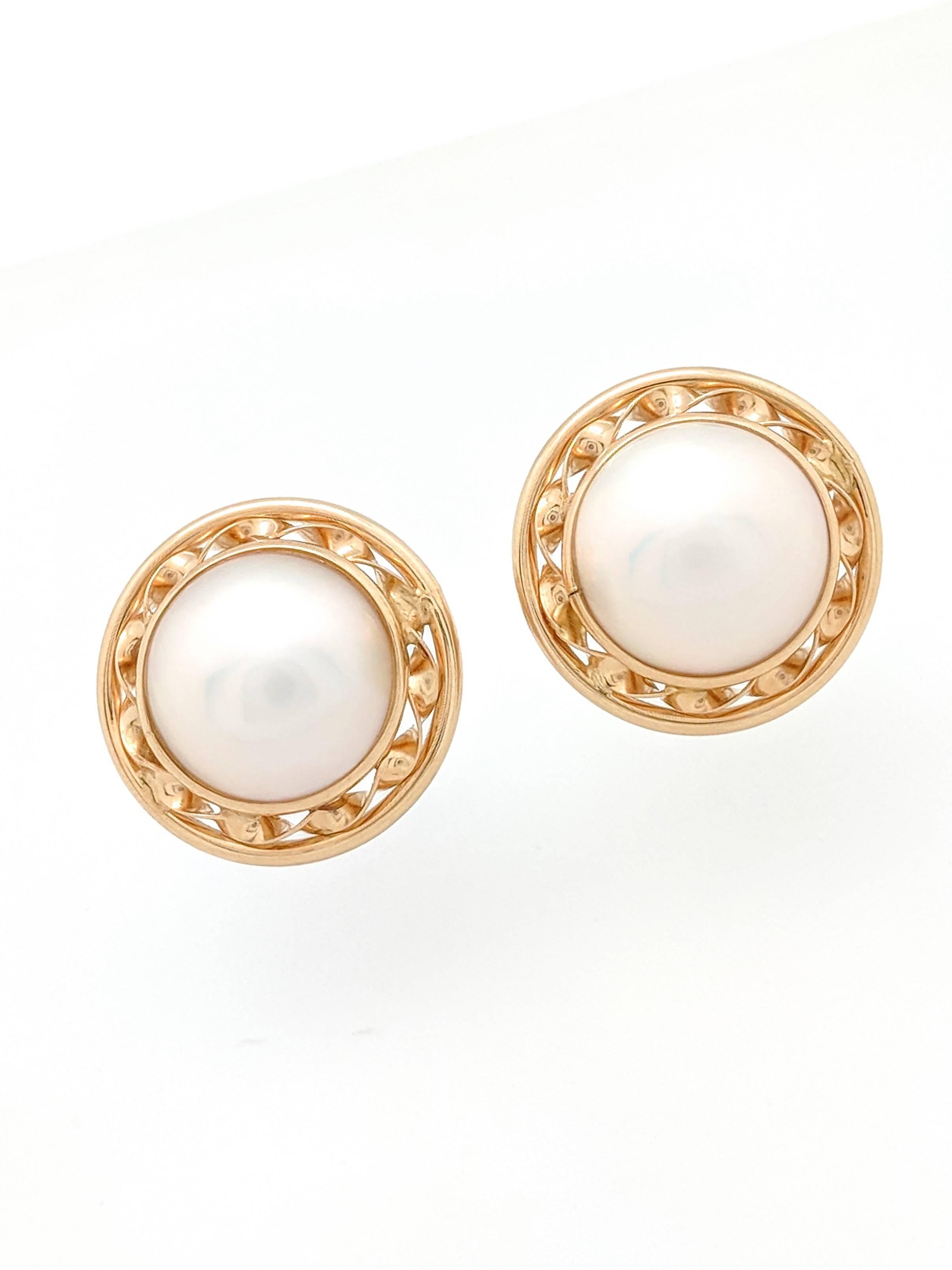 Ladies 14k Yellow Gold 13mm Mabe Pearl Earrings

You are viewing a beautiful pair of 13mm Mabe Pearl Earrings. These earrings are crafted from 14k yellow gold and weigh 7.5 grams. Each earring features (1) 13mm Mabe Pearl. The earrings measure 20mm
