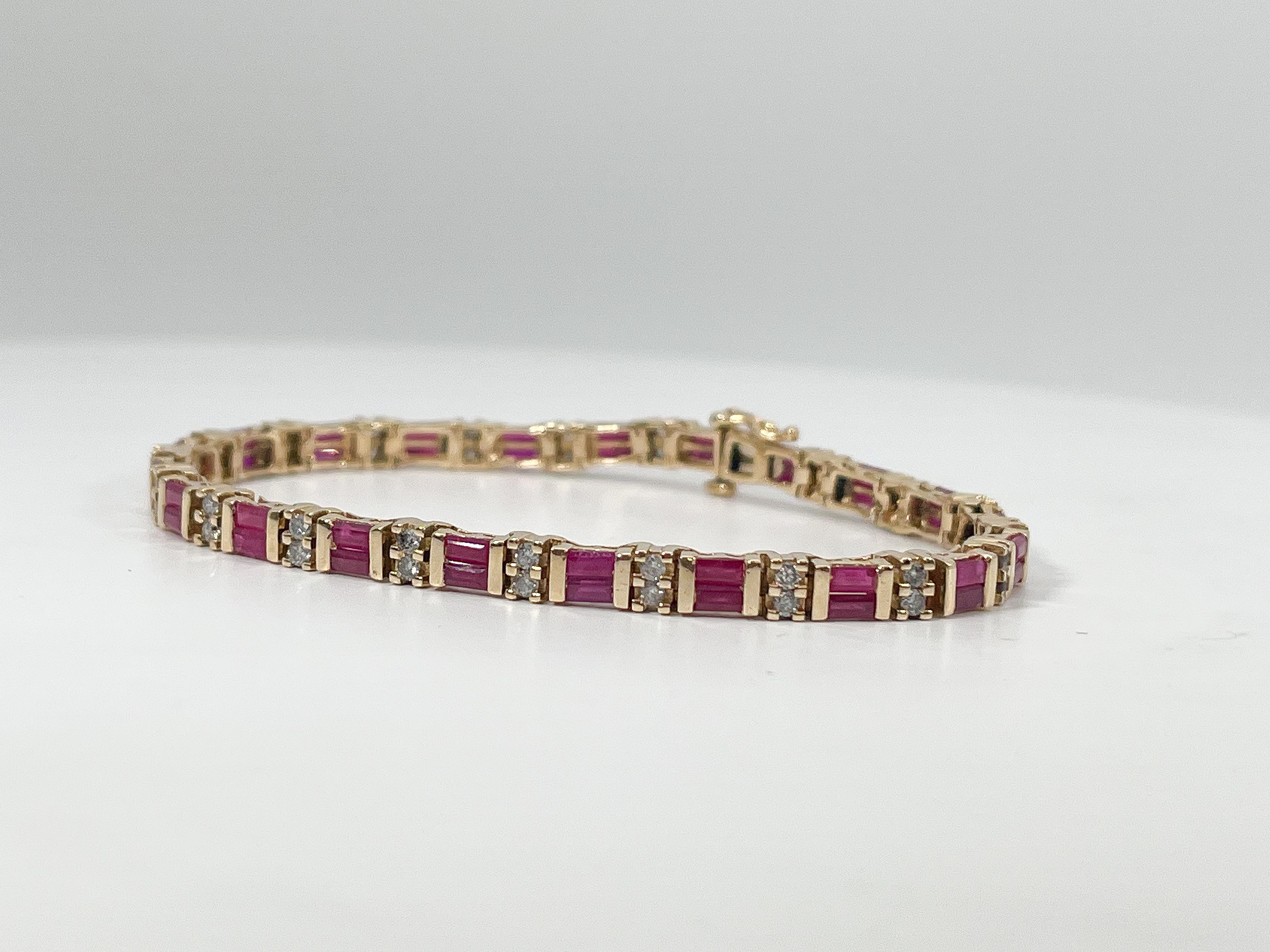 14K Yellow Gold .14 CTW Ruby and .20 CTW Diamond Bracelet. All the rubies are straight baguettes, all the diamonds are round, bracelet has a figure 8 clasp to open and close, bracelet is 7 1/4