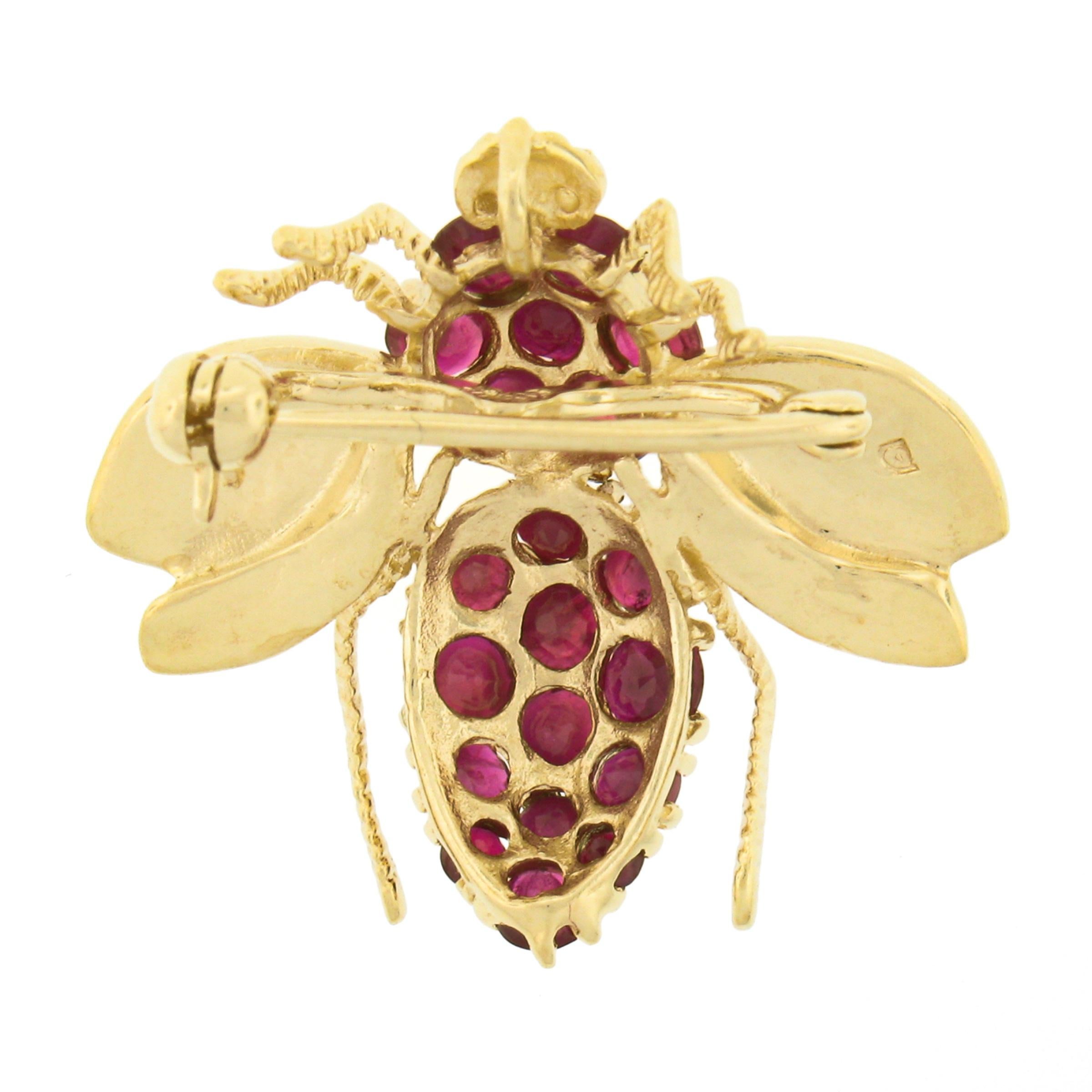 Here we have an incredibly detailed pin/brooch that was crafted from solid 14k yellow gold. The brooch features a fly/bee insect design that is drenched with fine quality rubies throughout its back. These round brilliant cut stones bring such an