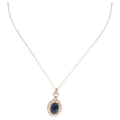 Collana con ciondolo in oro giallo 14K con zaffiro blu da 14,29 carati e diamante da 0,28 carati, 18 cm.