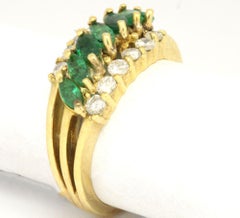 14 Karat Yellow Gold 1.45 Carat Emerald and Diamonds Triple Row Ring