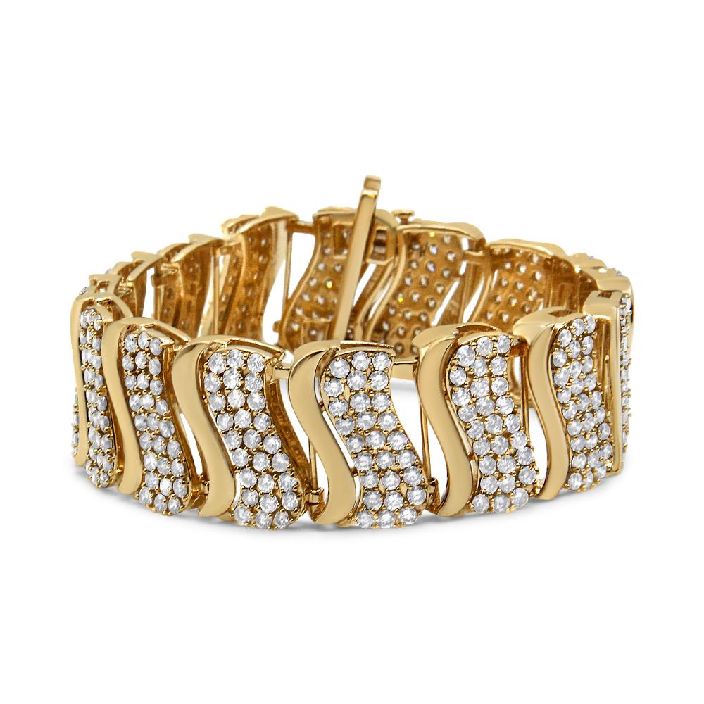 Make your grand entrance with this luxurious diamond link bracelet. Crafted from weaves of warm 14K Yellow Gold, this gorgeous look features curved vertical links alternating with sparkling diamond-lined and polished finishes.  The bracelet