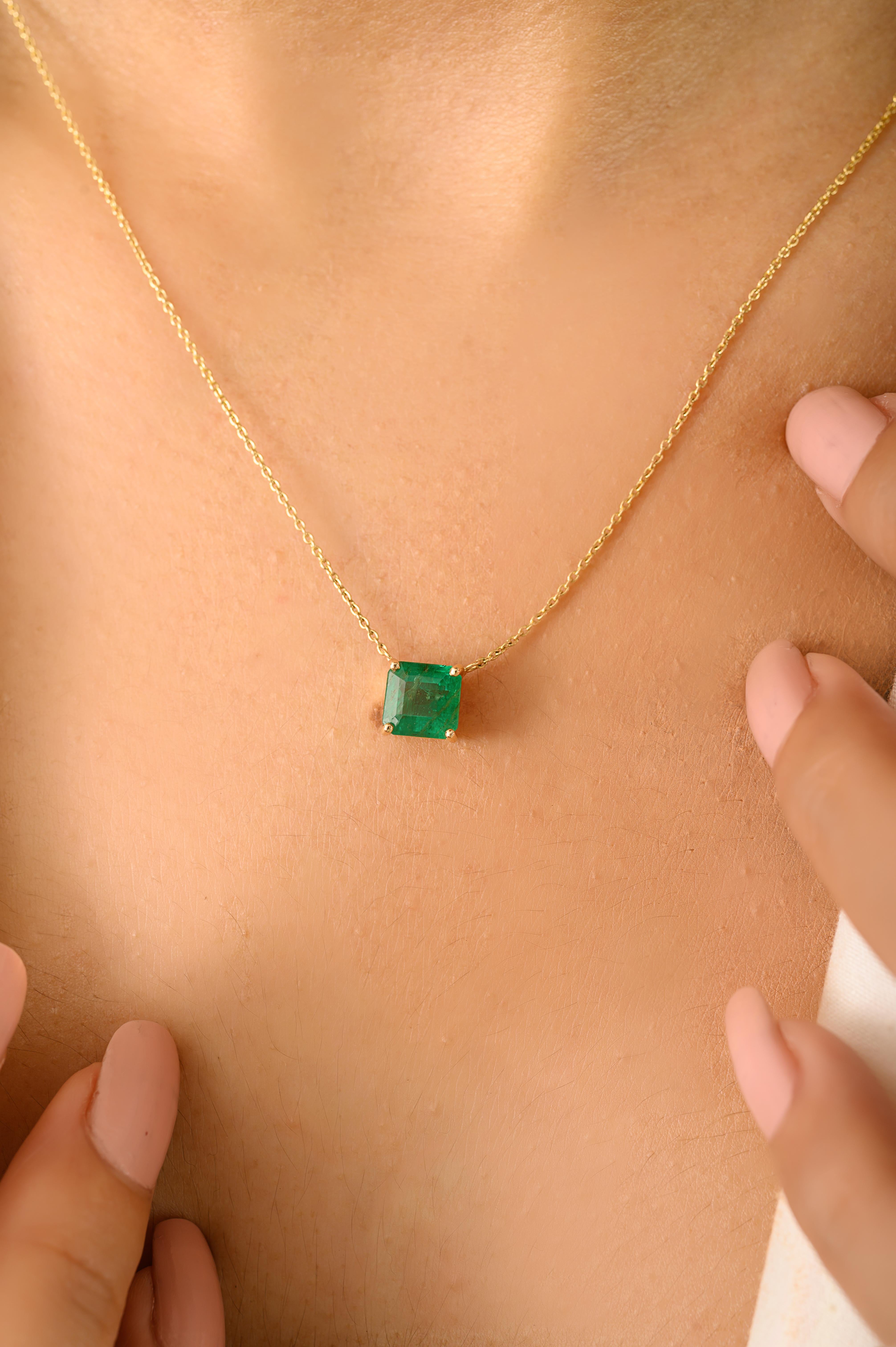 Designed with a 1.51 carat square-cut natural emerald, this elegant pendant necklace is crafted in solid 14K yellow gold. The vibrant green emerald is set in a minimalist four-prong setting, perfect for both everyday wear and special