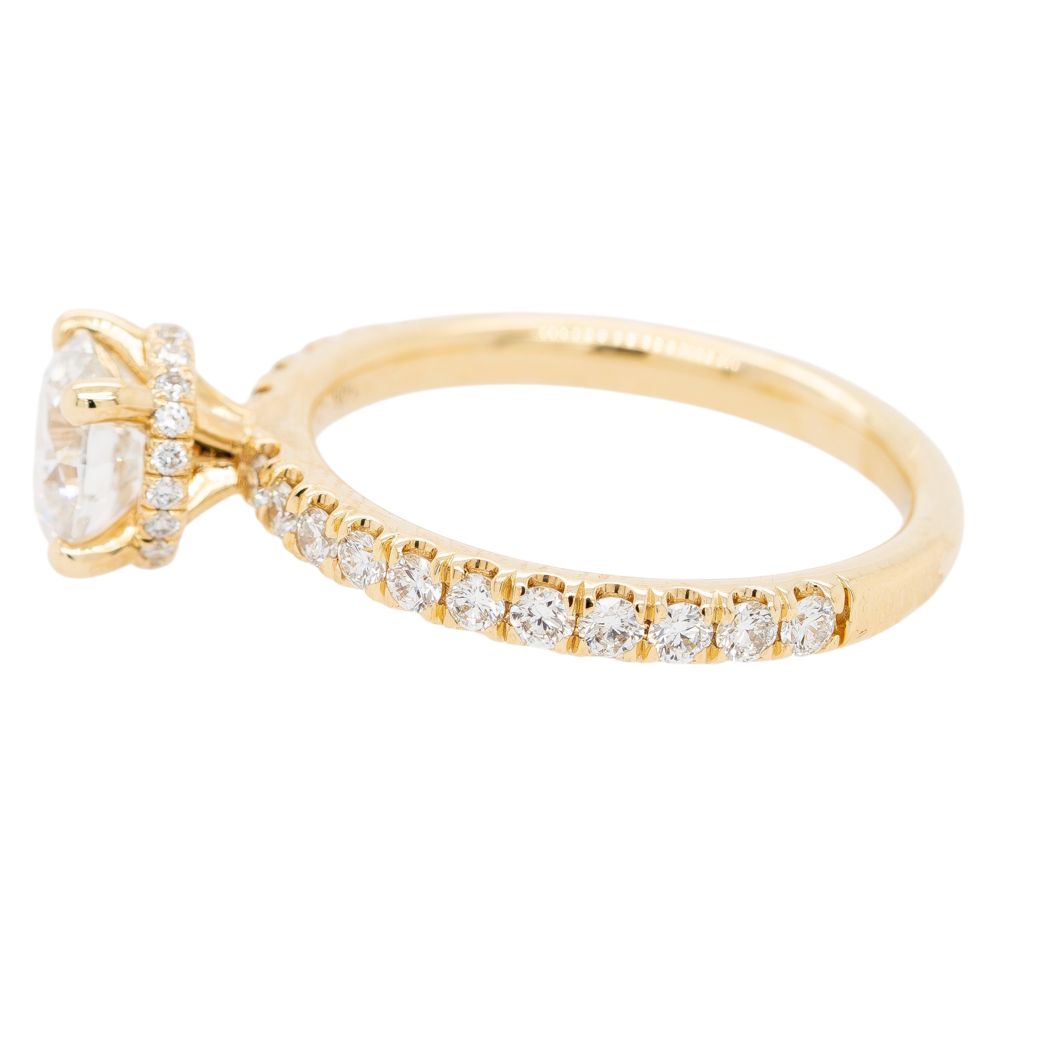 This elegant engagement ring features a dazzling 1.02-carat round brilliant diamond, graded H color and SI1 clarity, certified by GIA (#5182228024). The center stone is set in a sophisticated Gabriel & Co. 14K yellow gold solitaire mounting that