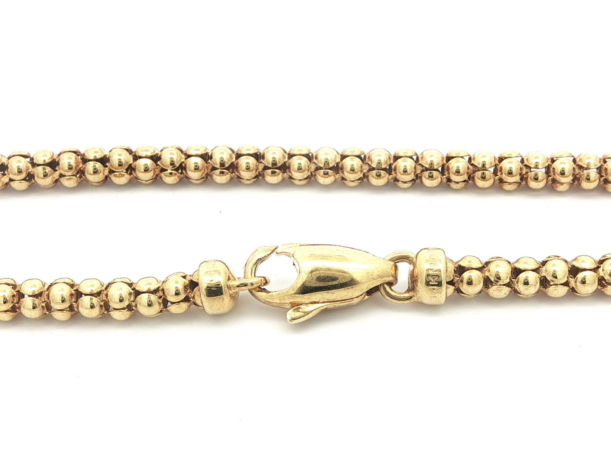 Materiale: Oro giallo massiccio 14k
Peso: 9 grammi
Tipo di catena: A Link Popcorn arrotondati e fantasia
Lunghezza della catena: 15,5 pollici (misurata accanto al righello)
Larghezza della catena: 3.2 mm (circa)
Chiusura: Chiusura ad