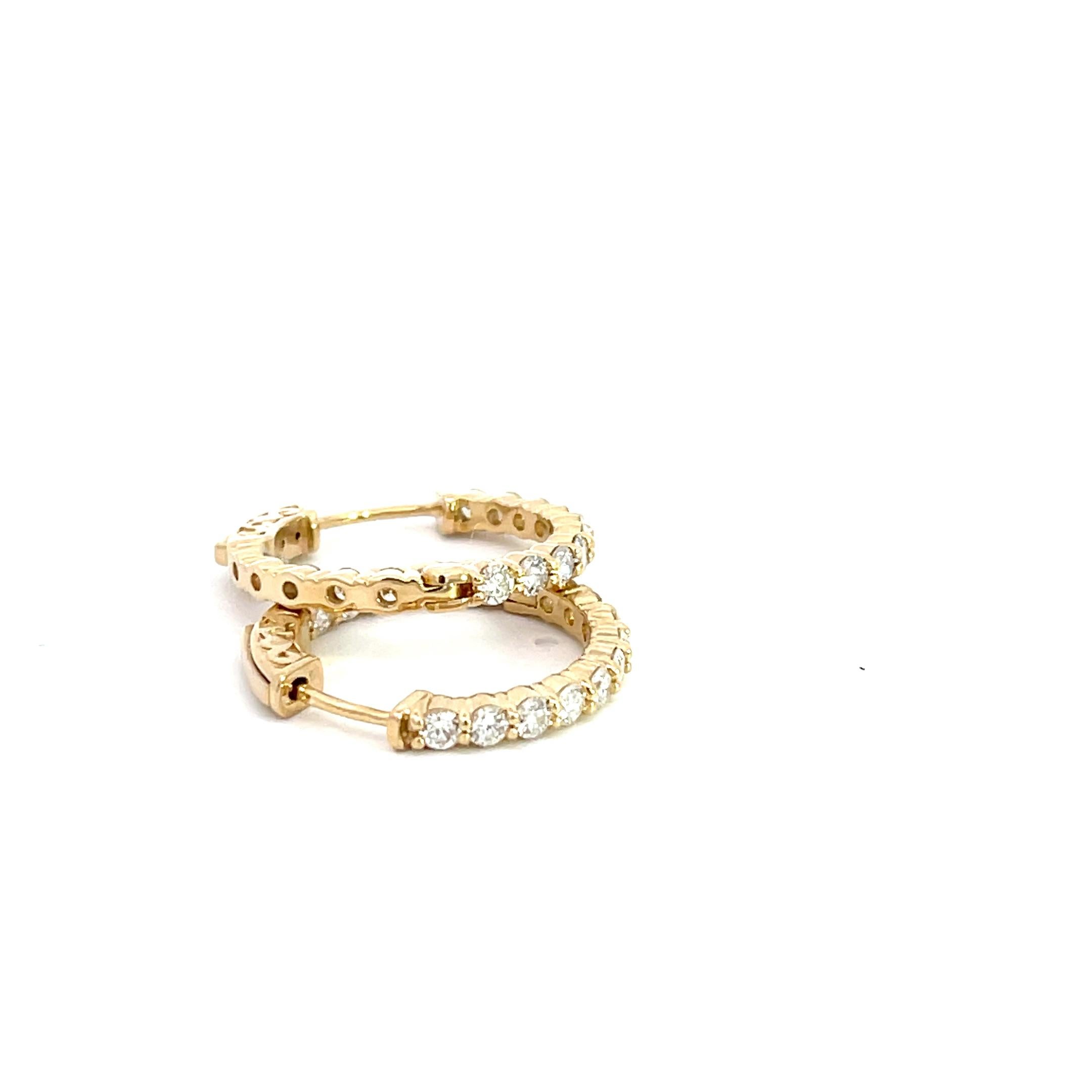 Introducing our exquisite 14K Yellow Gold 1.63ctw Diamond In and Out Hoop Earrings, a dazzling addition to your jewelry collection. Crafted with utmost precision, these hoops exude elegance and sophistication. Made from lustrous 14K yellow gold,