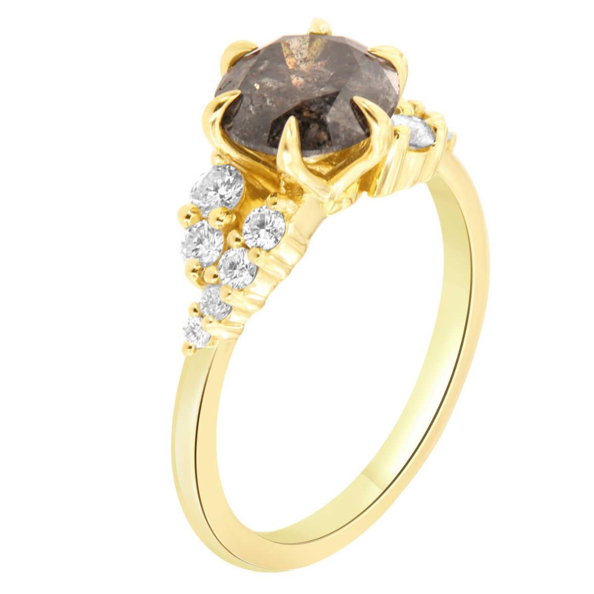 This 14k yellow gold ring features a 1.85 Carat Round shape Natural Salt & Pepper diamond set in six (6) delicate claw prongs. Twelve (12) brilliant round diamond prongs are set on top of a 1.6 mm wide band with a total weight of 0.34 carat.  
The