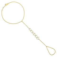Chaîne à la main cercles célestes en or jaune 14 carats avec 19 diamants