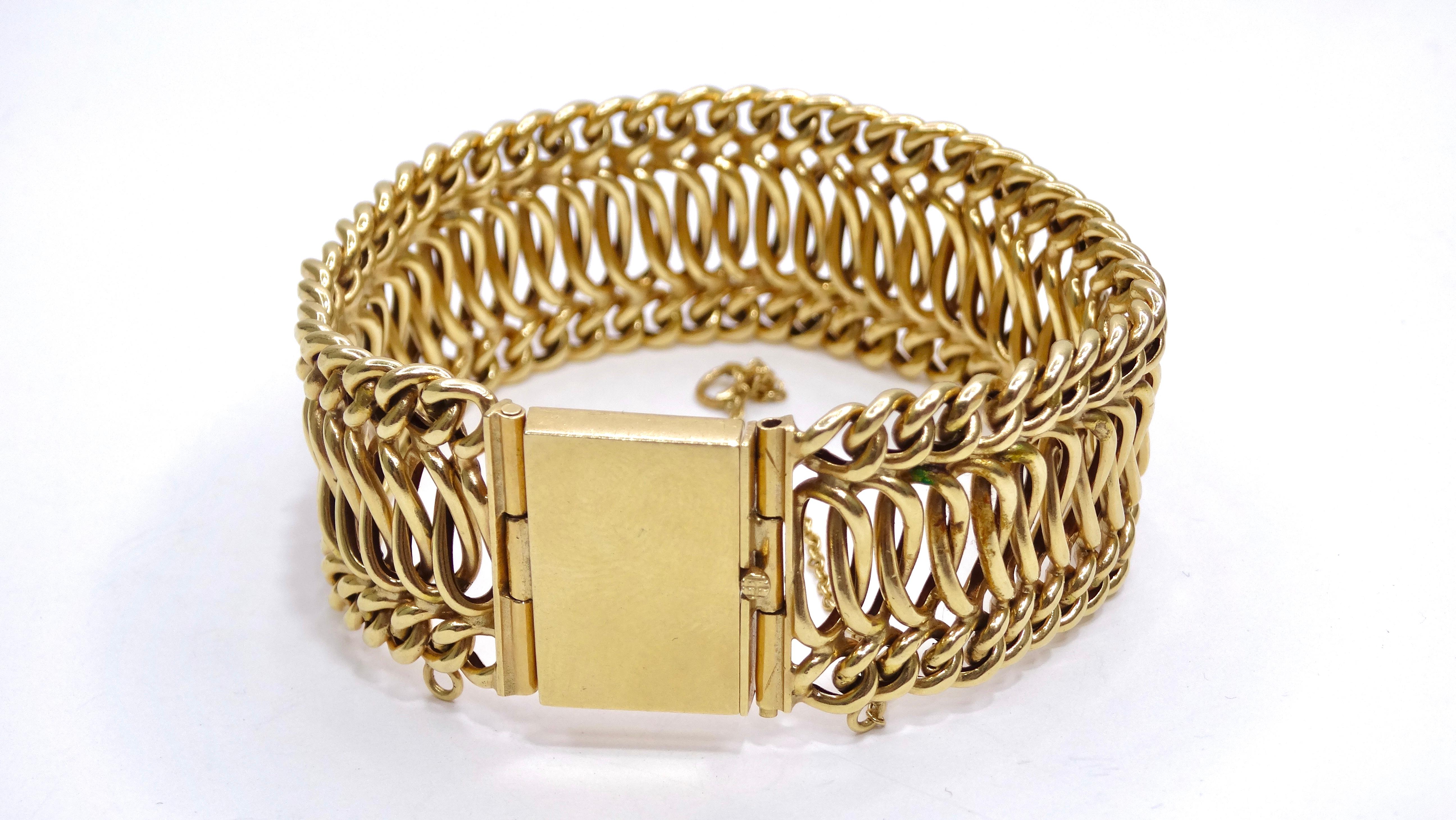 This circa 1950's chain bracelet gives an upgrade to the gold chain bracelet in your drawer. The details on this bracelet is something to write home about as it has a tons of intricate woven metal. Pair this beautiful bracelet with a vintage printed