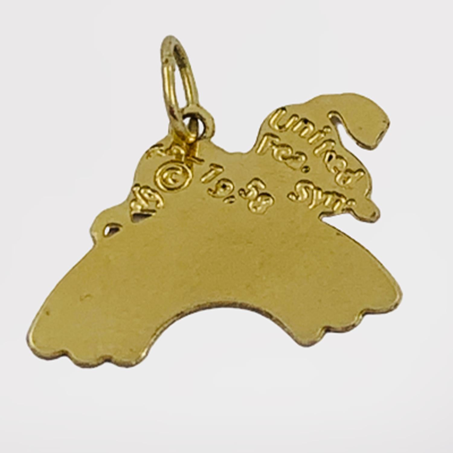 Officially Licensed Vintage Snoopy on Rainbow Charm Made in 1958

Crafted of solid 14K yellow gold, this little charm is perfect for the 'Peanuts' comic lover in your life. The charm features the beloved 'Peanuts' canine 'Snoopy' laying on a