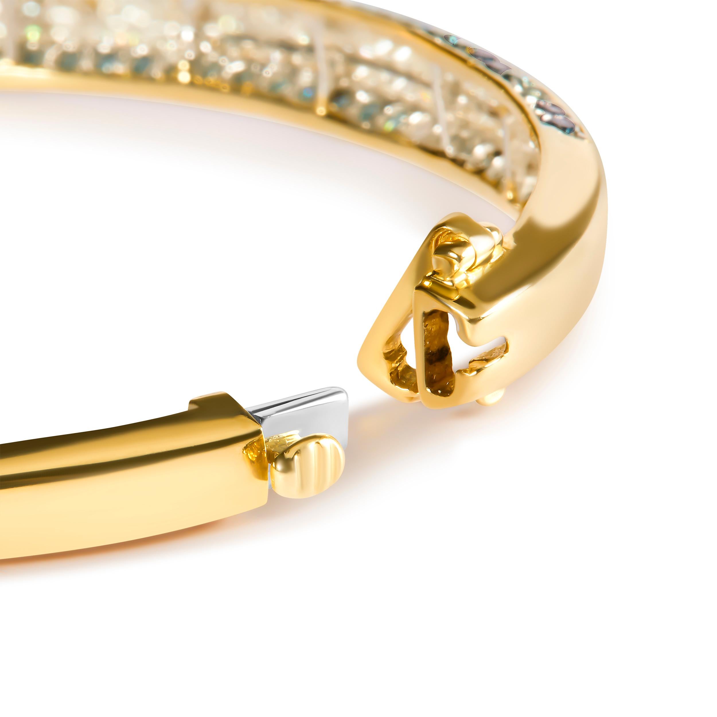 Indulge in the beauty of this 14K Yellow Gold Bangle Bracelet adorned with 142 Natural Princess-cut Diamonds totaling 2.0 Cttw. The treated Blue and White Diamonds are set in a Channel setting, showcasing their H-I Color and SI2-I1 Clarity. This