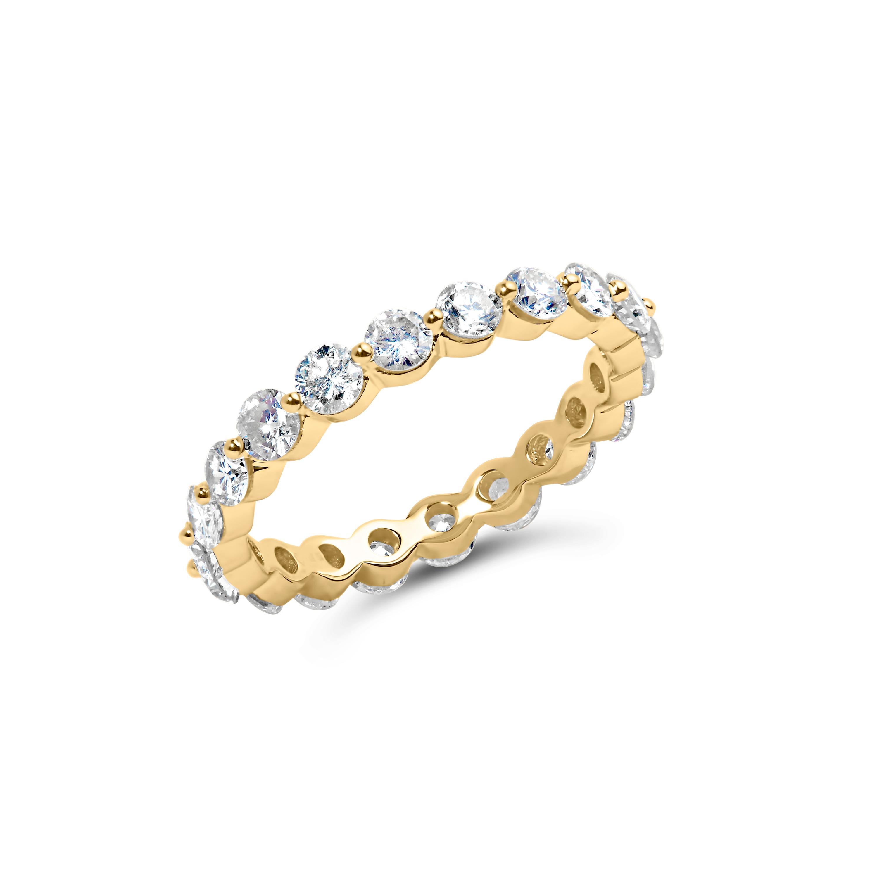 Introducing a mesmerizing masterpiece that will adorn your finger with timeless elegance. Crafted in 14K yellow gold, this enchanting eternity band ring is a symbol of eternal love and everlasting beauty. With a remarkable 2.0 cttw of 20 natural