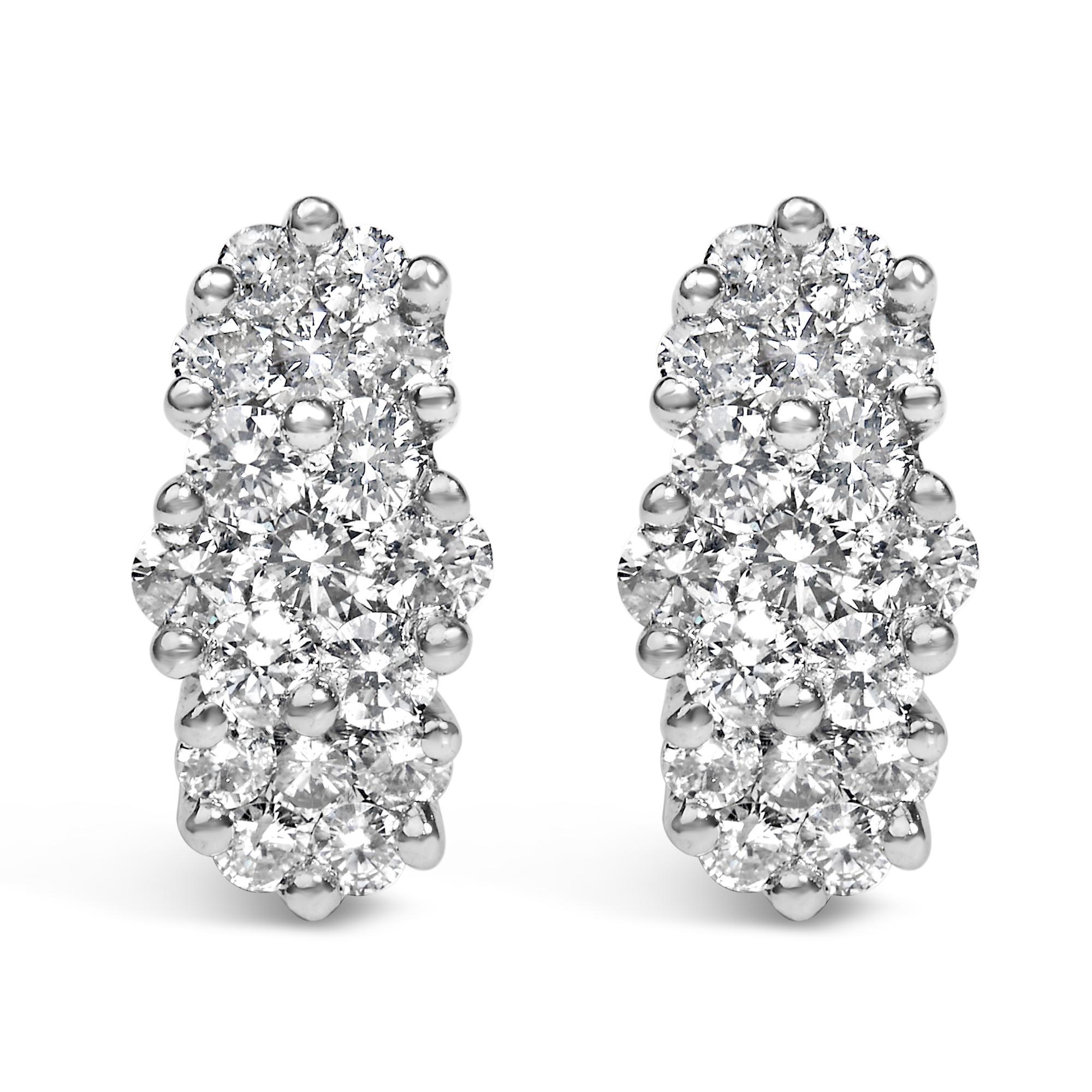 Discover the epitome of elegance and craftsmanship with these 14K yellow gold stud earrings, each piece captivating with its luxurious cluster design. Encrusted with a splendid array of natural diamonds totaling 2.00 carats, these studs radiate with