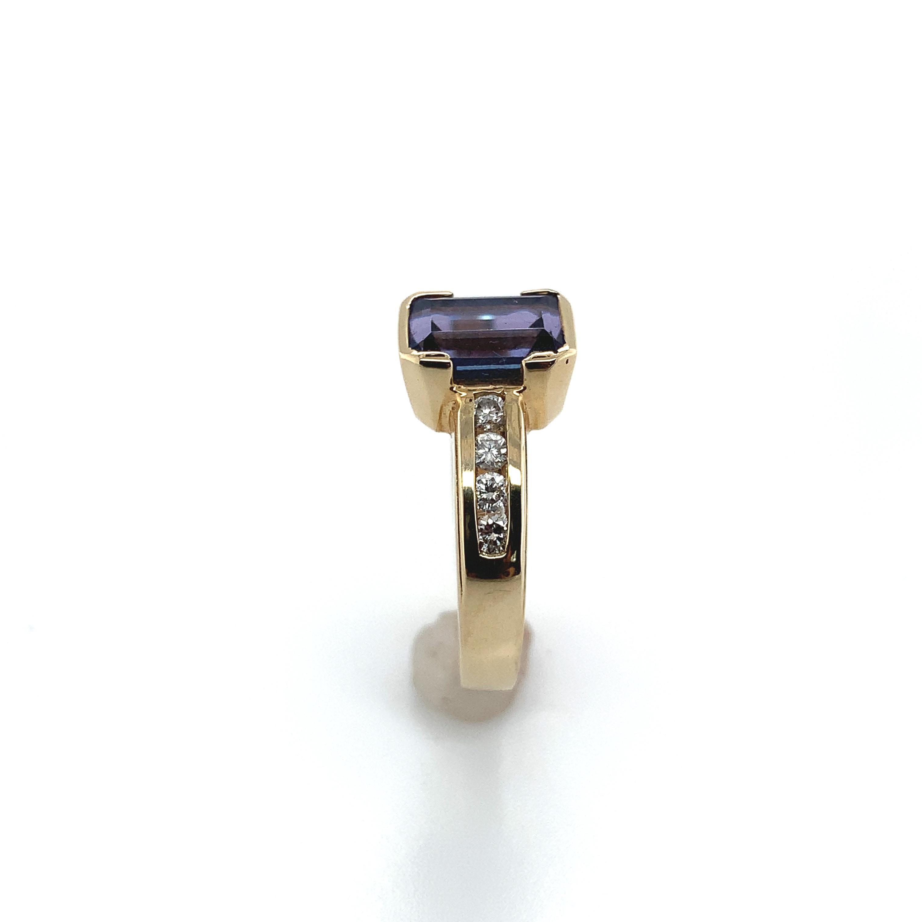 14k Yellow Gold 2.17ct Emerald Cut Genuine Natural Tanzanite Ring (#J1840)

14k yellow gold tanzanite and diamond ring featuring an emerald cut 2.17 carat tanzanite and eight round brilliant cut diamonds weighing .25ct total weight. The tanzanite is