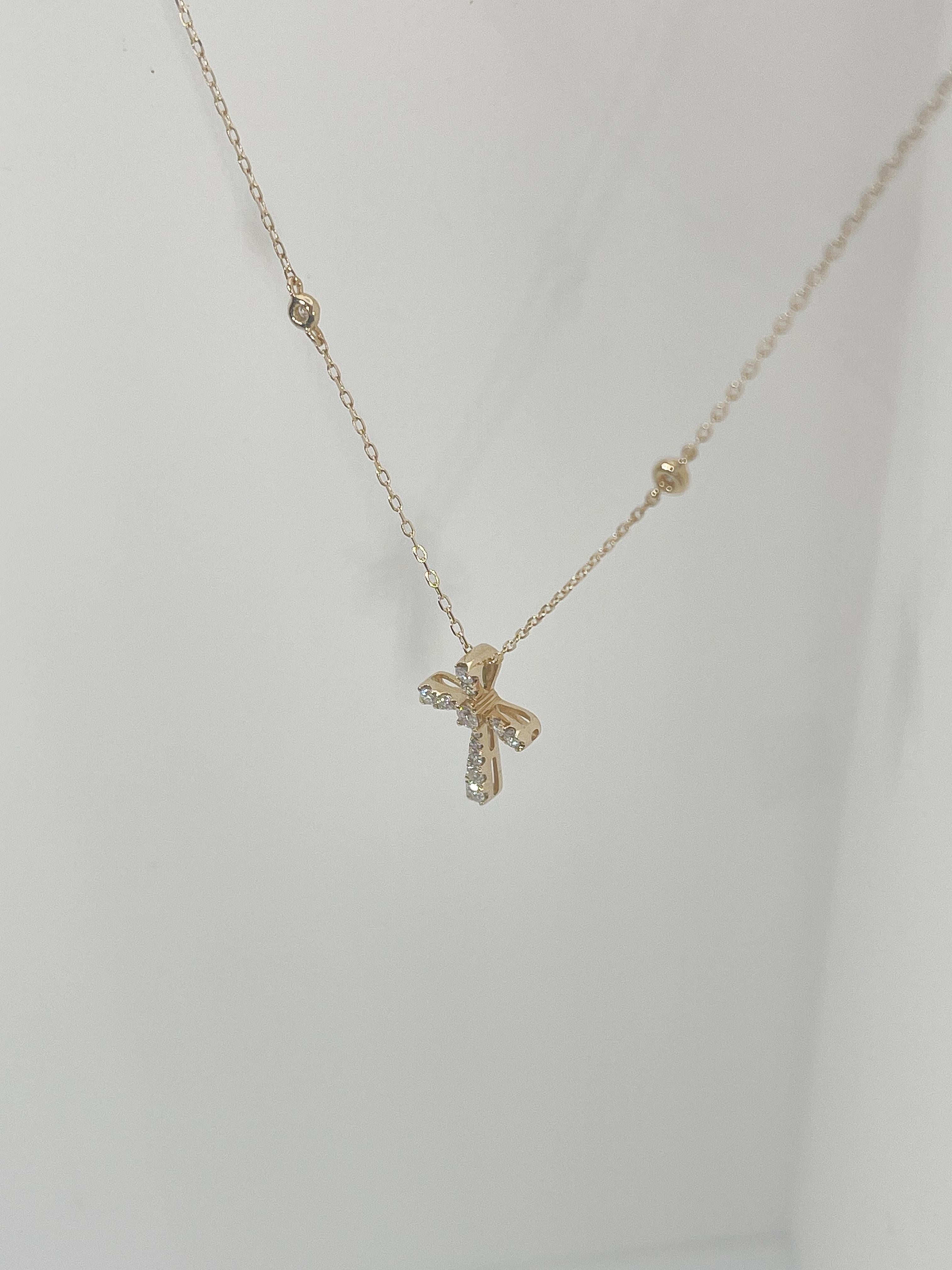 Round Cut 14K Yellow Gold .22 CTW Diamond Cross Pendant Necklace with Diamond Stations For Sale