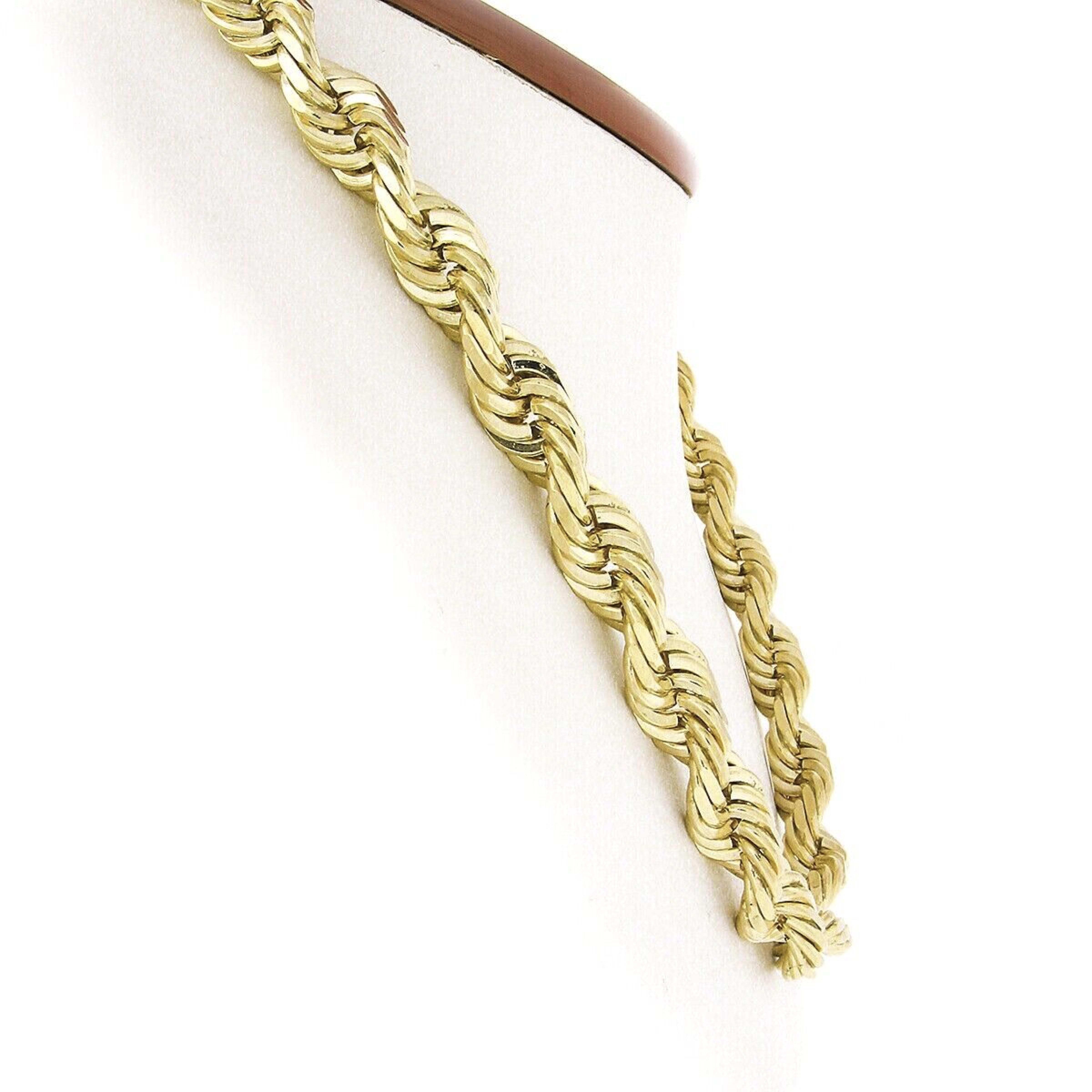 This magnificent necklace was crafted from solid 14k yellow gold and features a very large and thick rope link chain with wonderful high polished finish throughout. This substantial and solidly made chain measures 22.5 inches in length and is