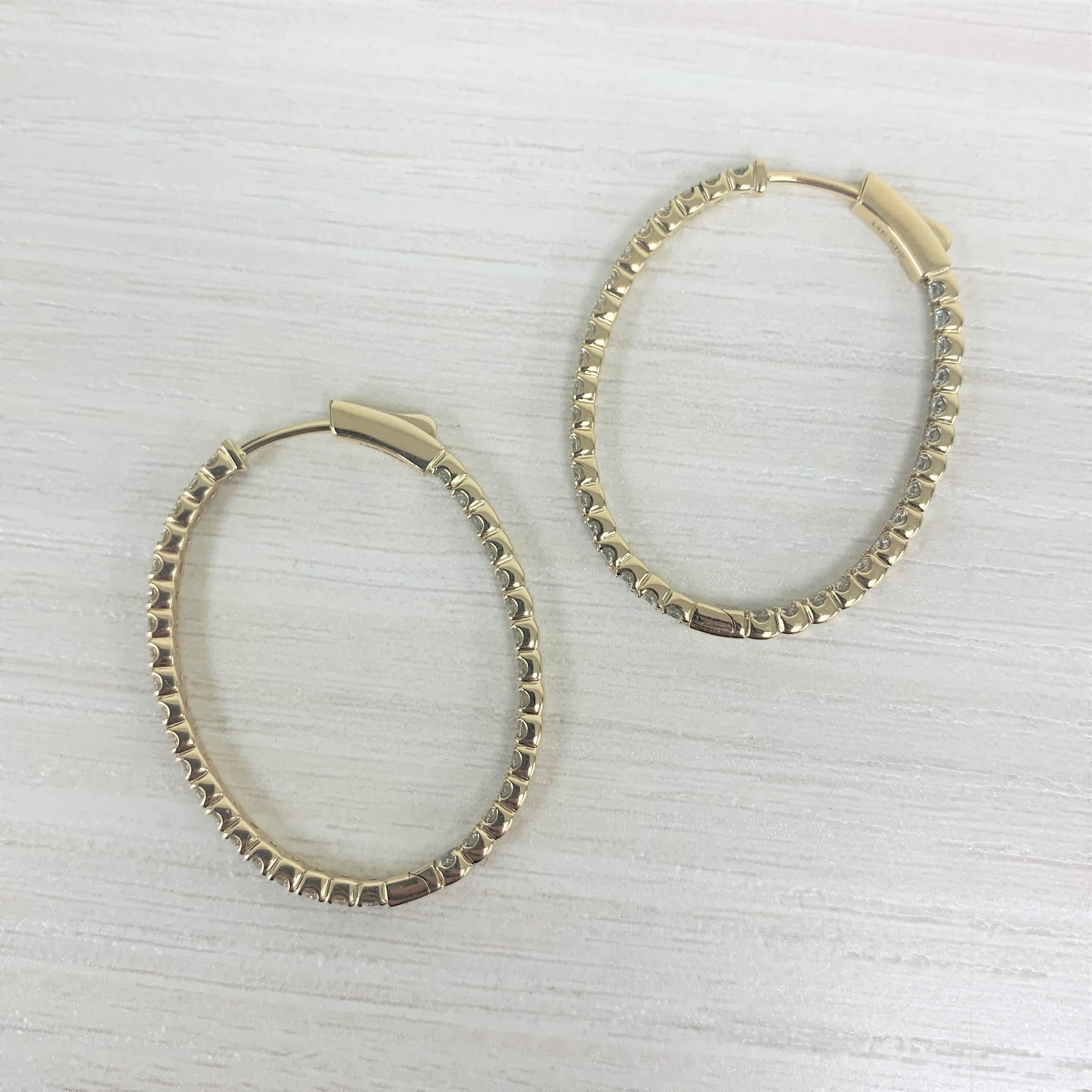 These Classic and Elegant Diamond Oval Hoop Earrings will frame your face beautifully! Crafted of 14K Yellow Gold these earrings feature approximately 2.28cts of Natural Round Diamonds. Diamond Color and Clarity is GH-SI1. Insert Latch for